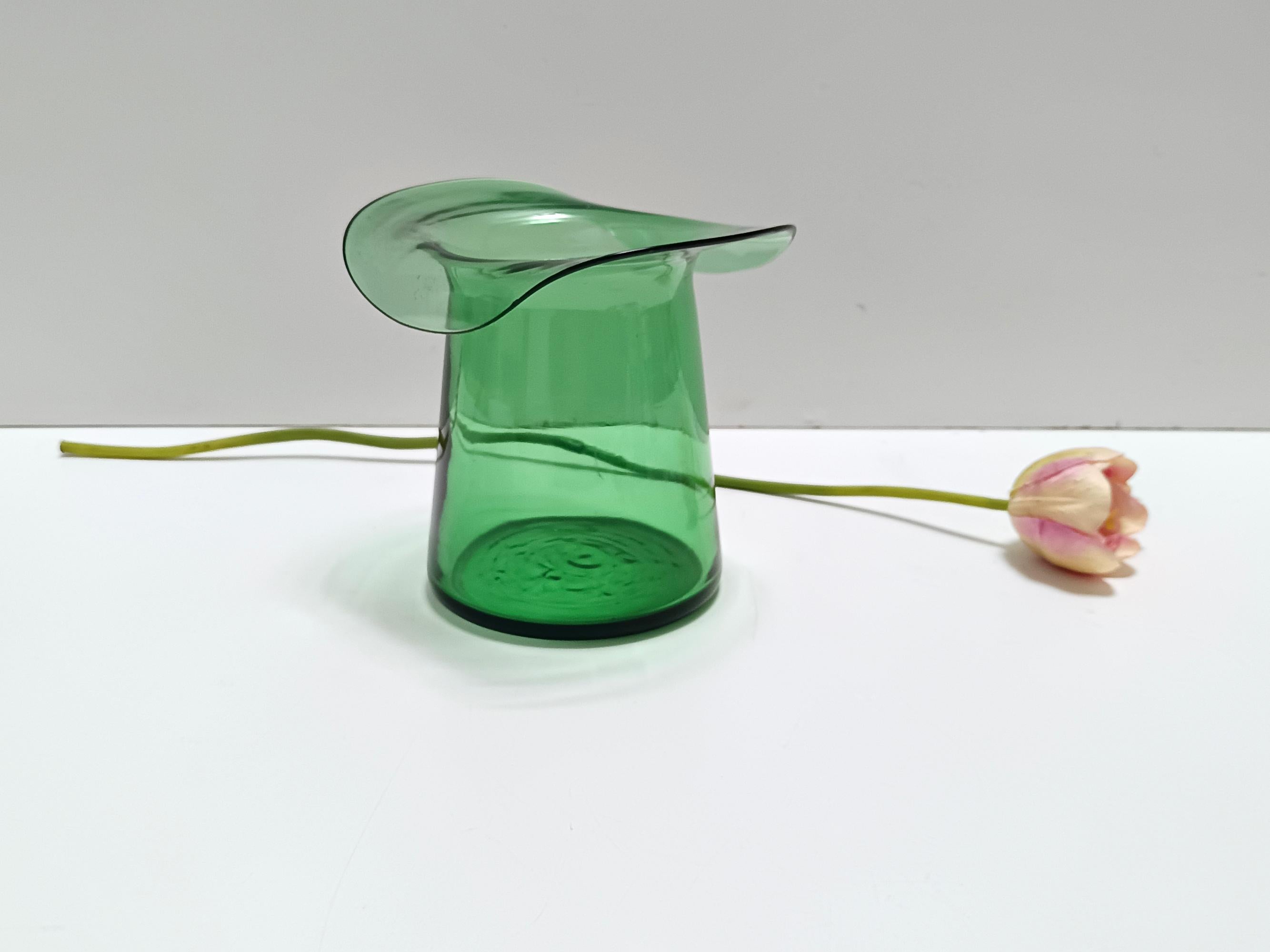 Made in Italy, 1940s - 1950s. 
Made in green hand-blown glass, in Empoli.
It is a vintage piece, therefore it might show slight traces of use, but it can be considered as in perfect original condition and ready to become a piece in a home.
