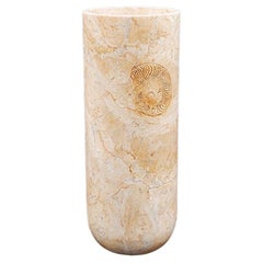 Cylindrical marble vase with fossil pattern