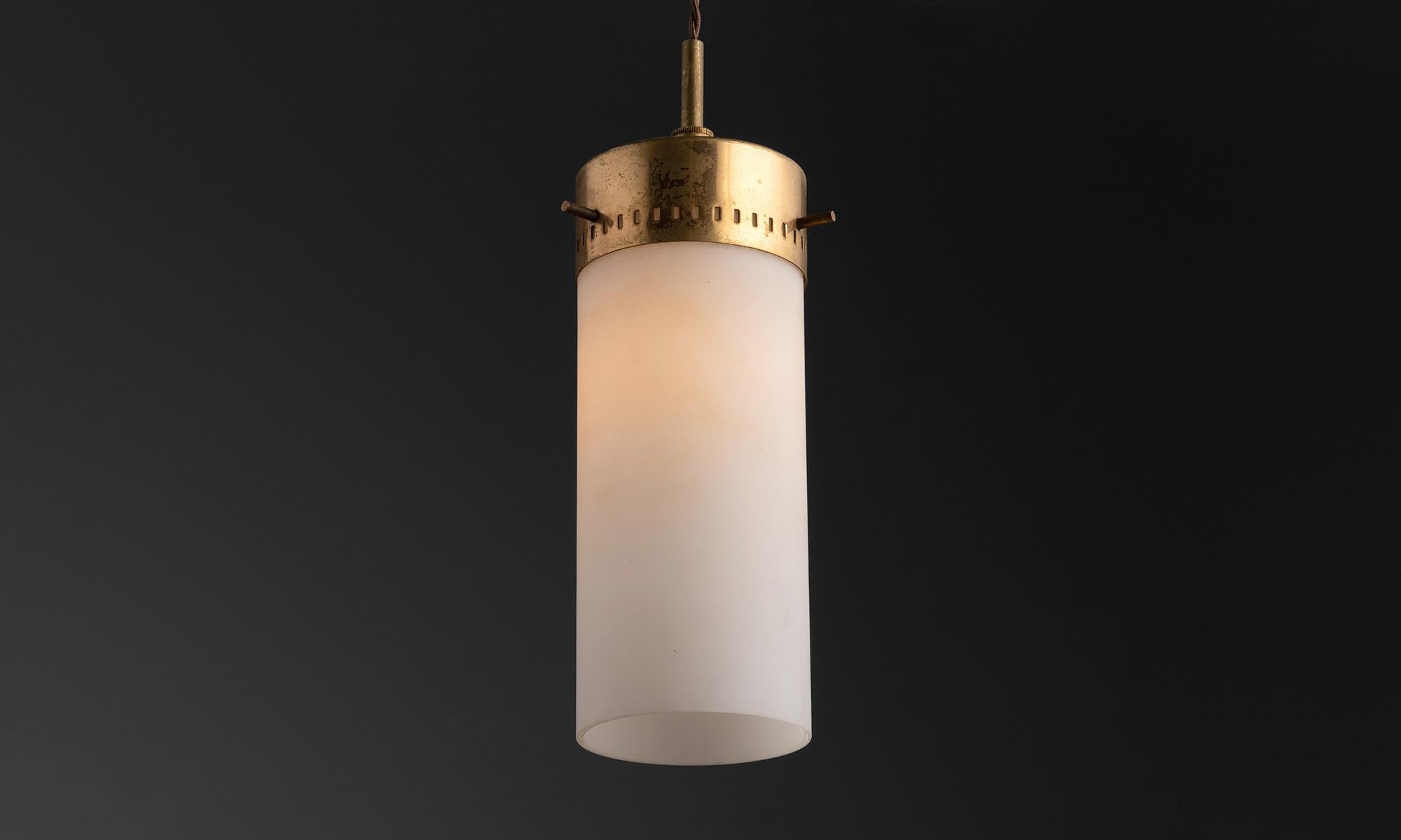 *Please note the price is per unit, and the lights are sold individually*

Cylindrical Modern Glass and Brass Pendant

Opaline glass shades with elegant brass fitter and canopy.

England Circa 1960

Measures: 4”diameter x 13.25”height.