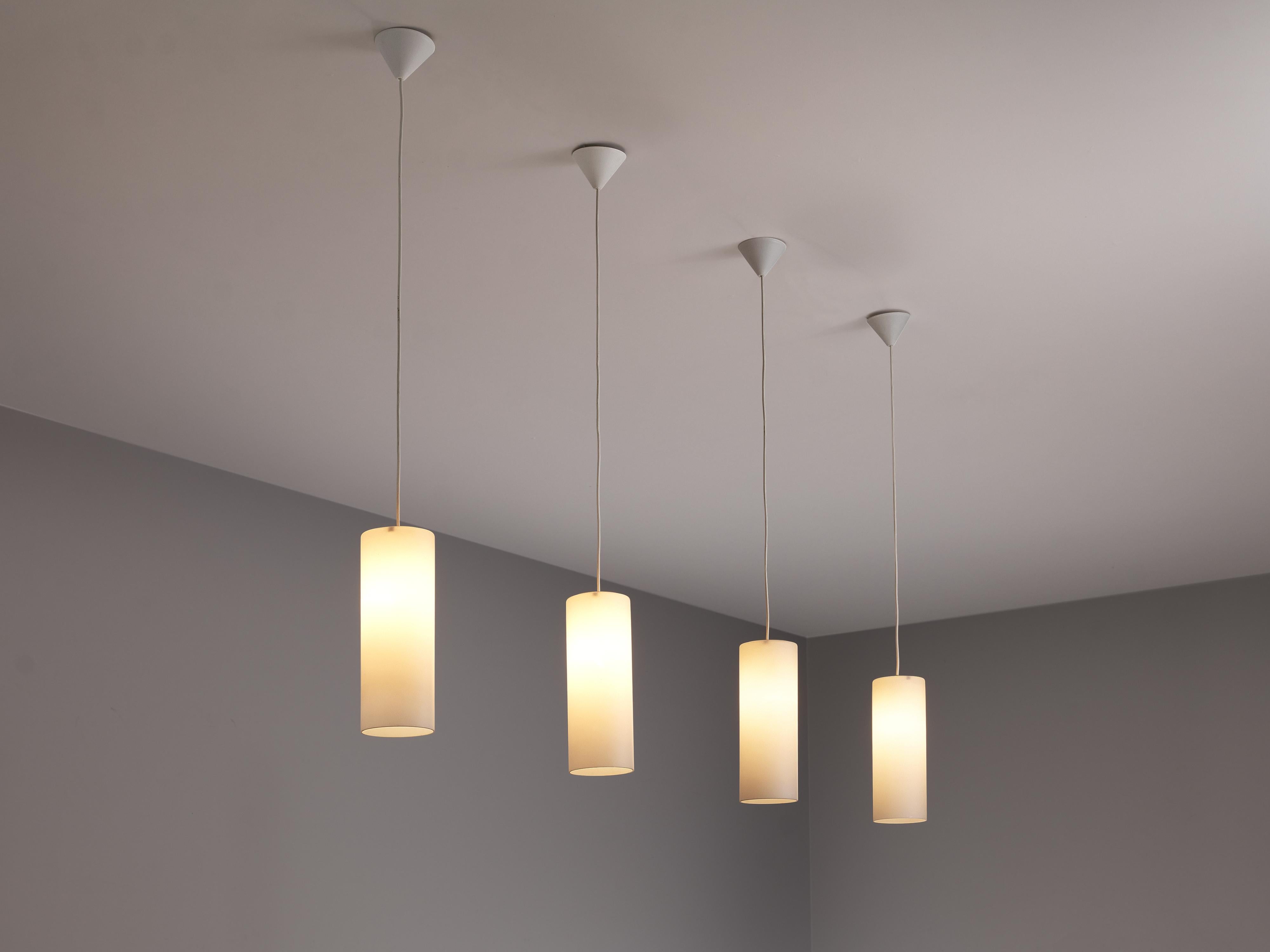 Pendants, matted glass, Europe, 1980s

With their matted glass shade in a cylindrical form, these pendants have a minimalist look. The light source creates a warm, atmospheric light. 

Please note that we have a large amount of these lamps in our