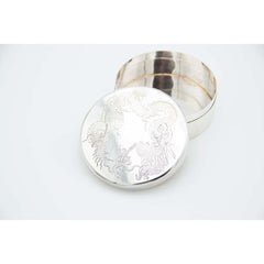 Cylindrical silver box with dragon engravings