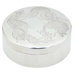 Cylindrical silver box with dragon engravings