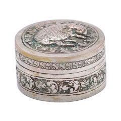 Cylindrical silver rosary box with embossed pig figure