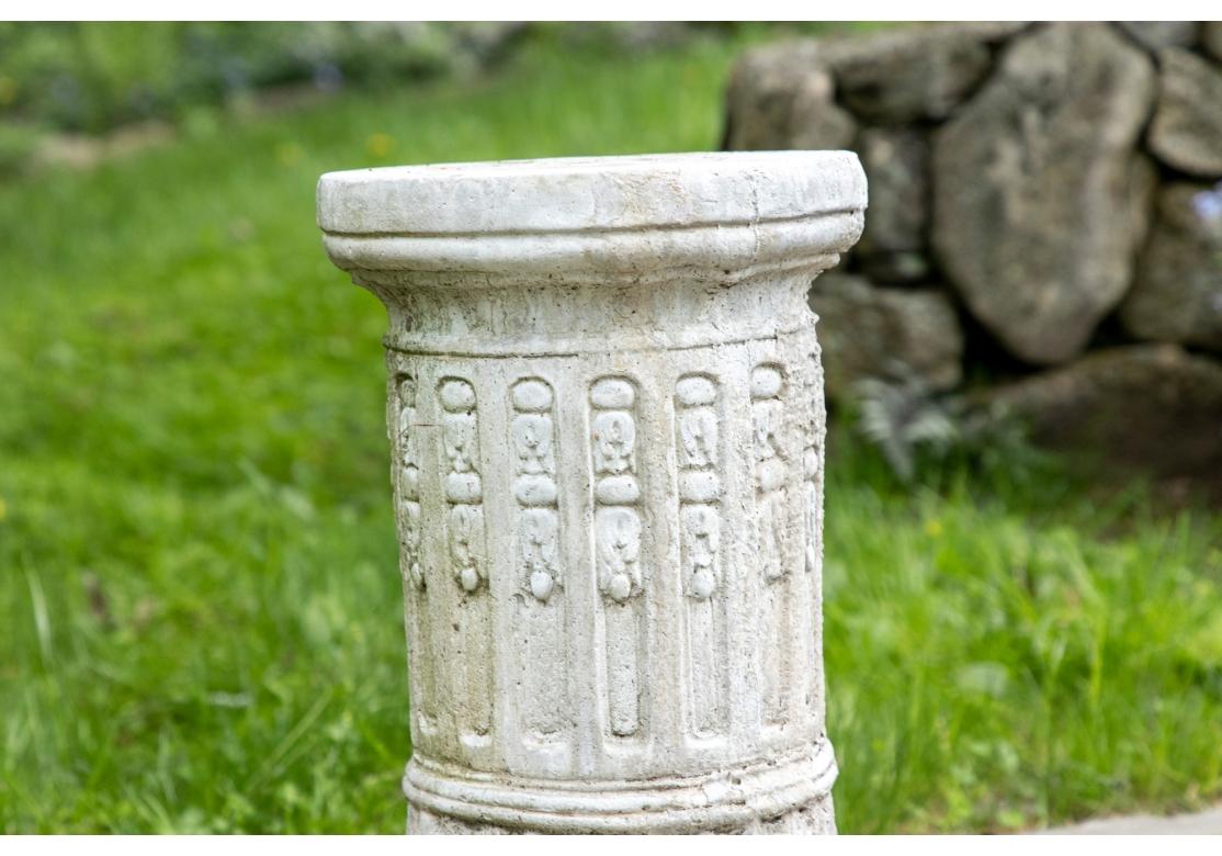 A cylindrical white stone garden pedestal with carved foliate motif.

Dimensions: 12