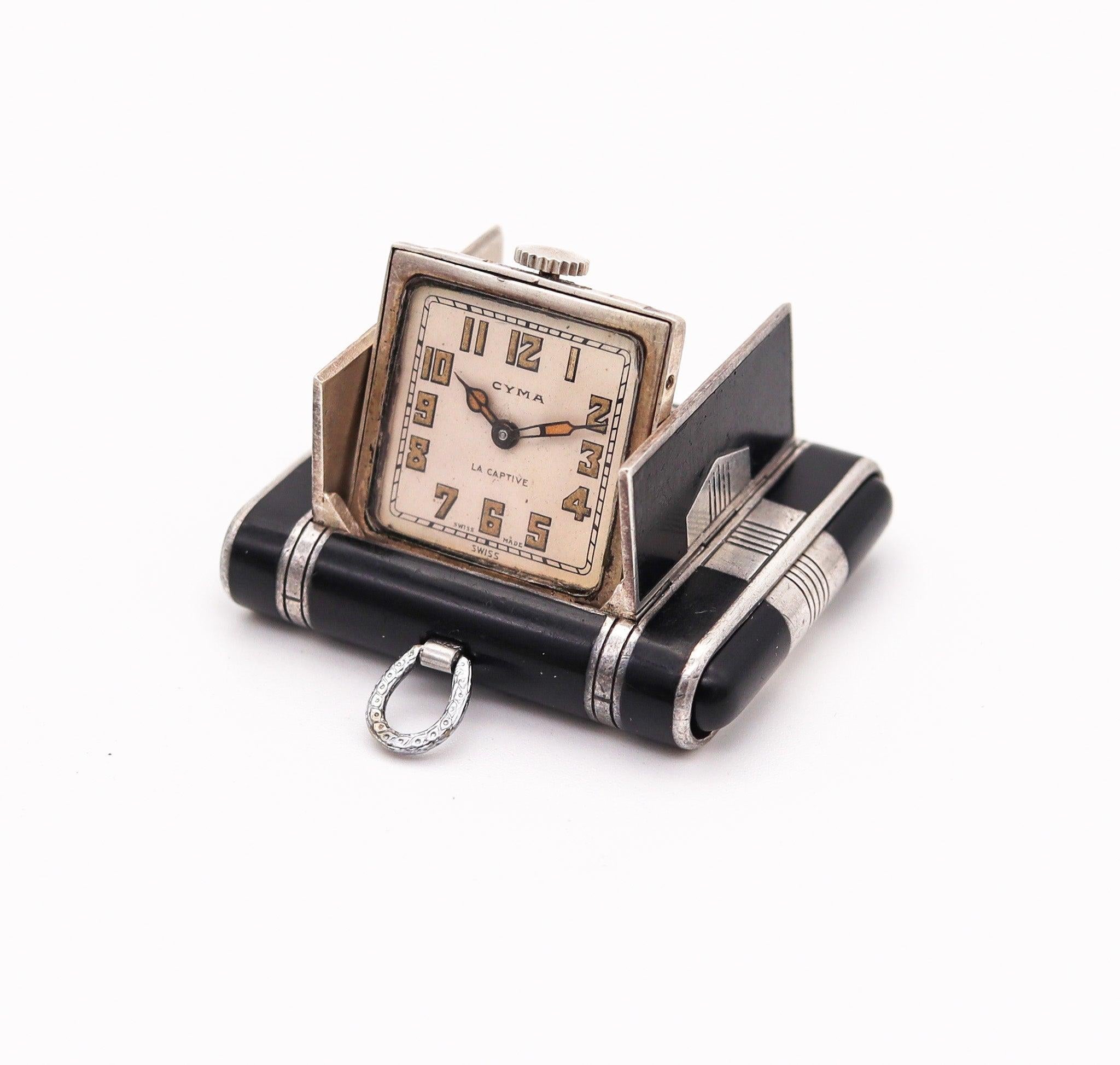 Art deco La Captive travel-purse clock designed by Cyma Watch Co.

This is a beautiful and unusual squeeze concealed 