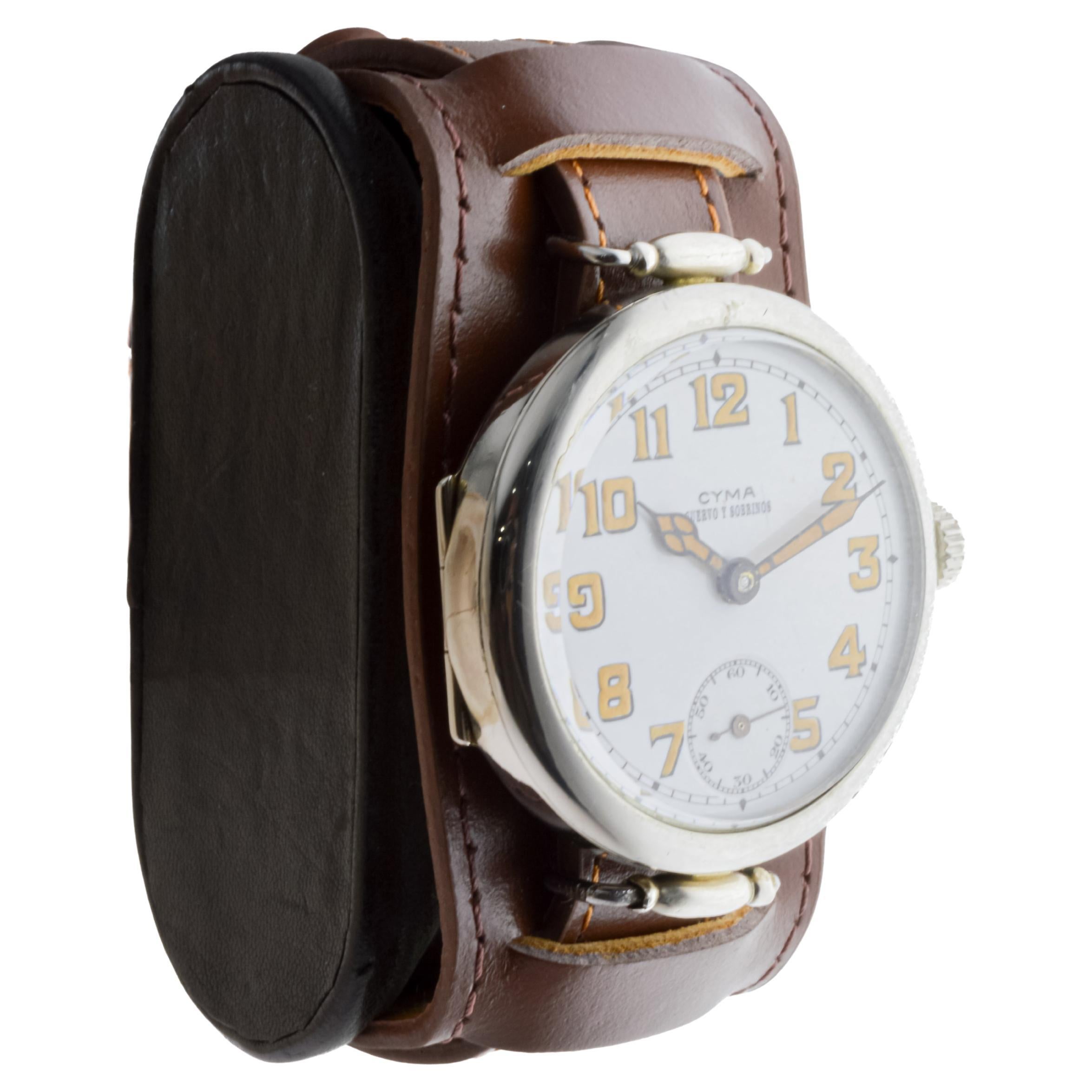 FACTORY / HOUSE: Cyma Watch Company for Cuervo & Sobrinos
STYLE / REFERENCE: Campaign Style / Trench Watch
METAL / MATERIAL: Nickel 
CIRCA / YEAR: 1915
DIMENSIONS / SIZE: Length 54mm X Diameter 37mm
MOVEMENT / CALIBER: Manual Winding / 15 Jewels /