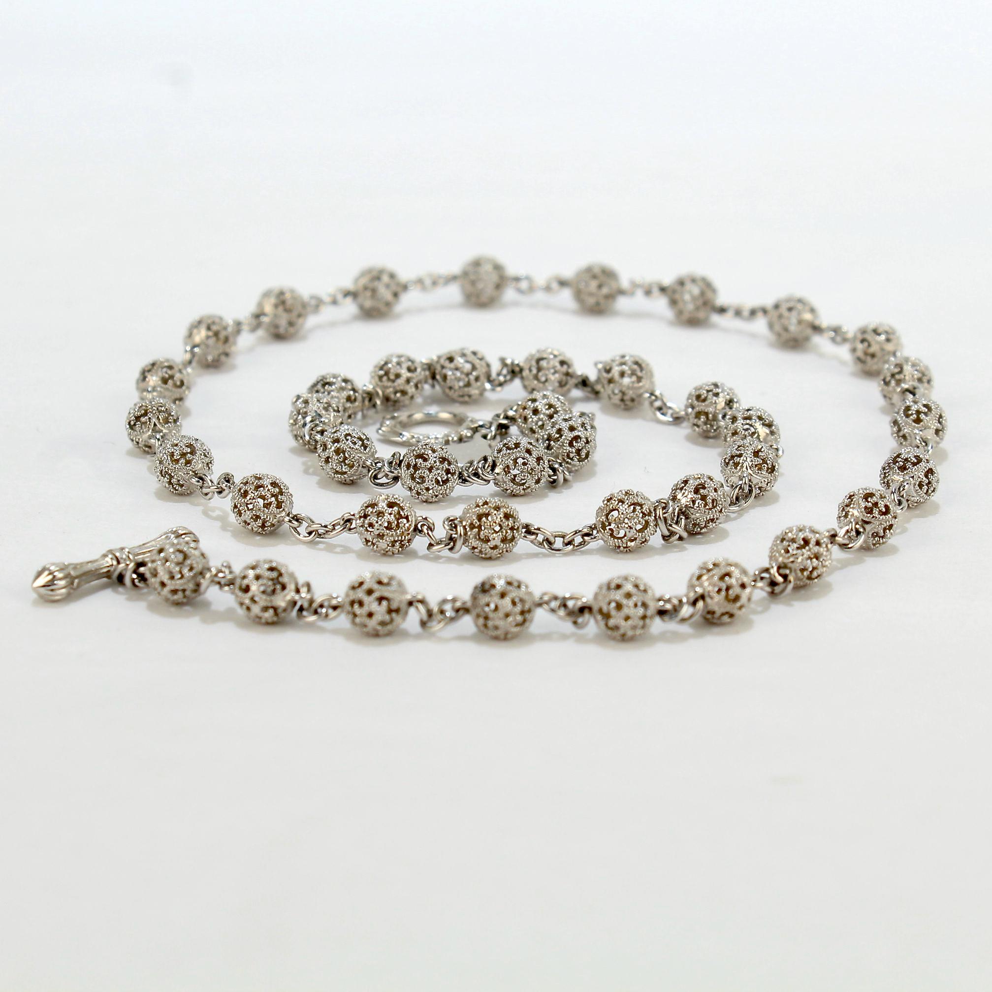 A very fine, signed Cynthia Bach 18k white gold filigree necklace.

With filigree and milgrain beads connected with white gold chain and toggle clasp.

Simply an wonderful necklace from a great maker!

Date: 
20th Century

Overall Condition: 
It is