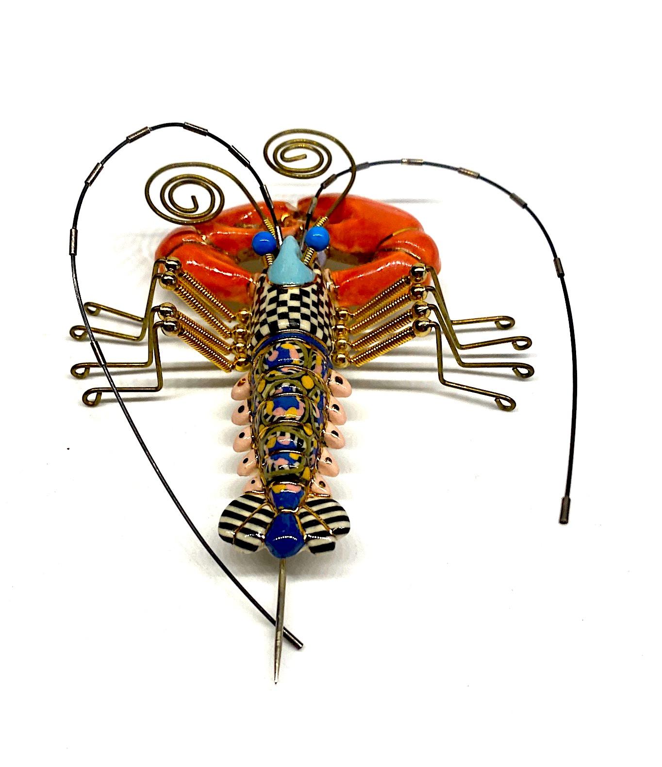 Always with a sense of whimsy, Jewelry 10 pieces designed by Cynthia Chuang and her husband Erh-Ping Tsai are highly collected and displayed. This is a one of kind hand made lobster brooch from the company Jewelry 10. The lobster porcelain body is