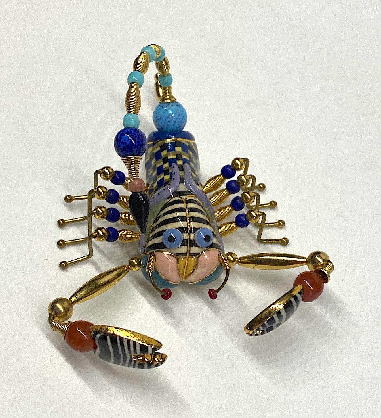 A one of kind hand made scorpion brooch from the company Jewelry 10. Always with a sense of whimsy, Jewelry 10 pieces designed by Cynthia Chuang and her husband Erh-Ping Tsai are highly collected and displayed. The scorpion porcelain body is