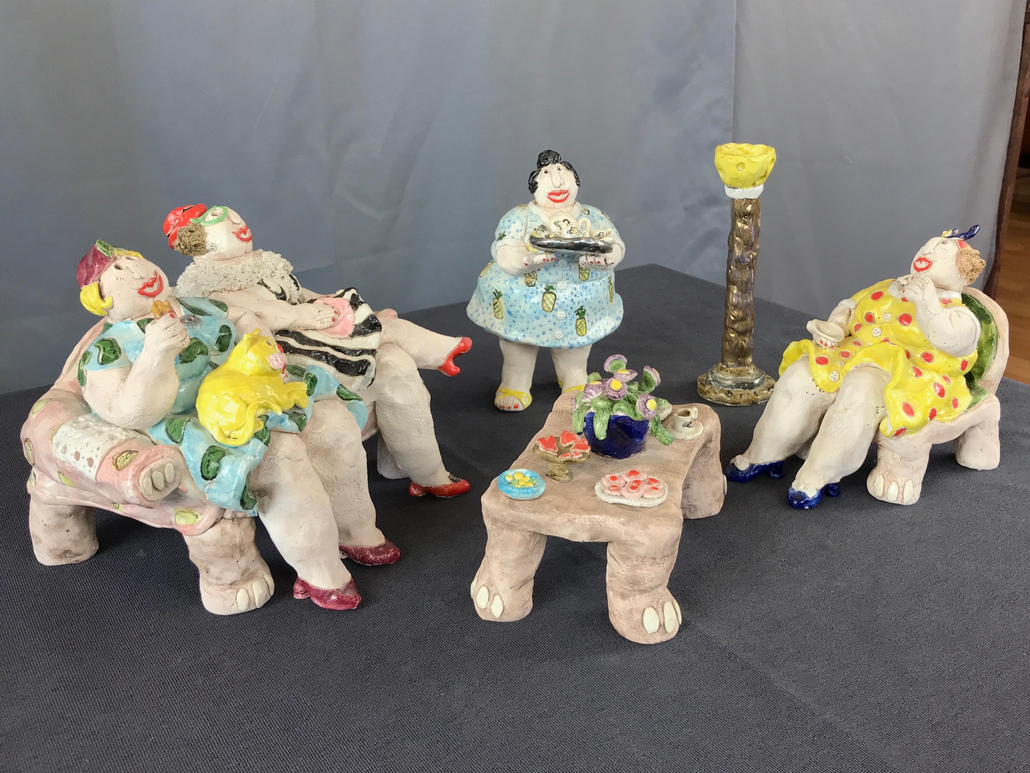 A 1987 five-piece ceramic sculpture of ladies at tea by Sonoma, California, artist Cynthia Hipkiss (b. 1948).

Whimsical vignette full of witty details depicting a lively sitting room tea party attended by a colorful quartet of carefree women.