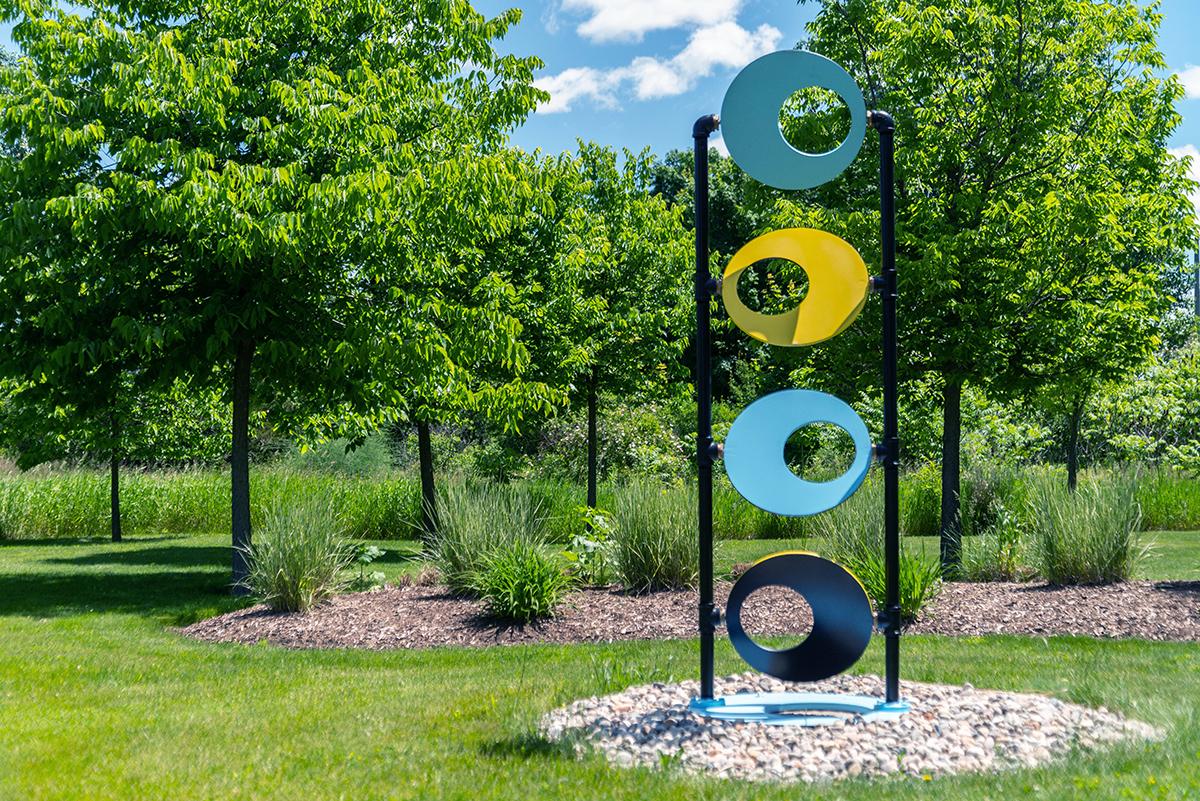 Discus - tall, interactive, geometric abstract, painted steel, brass, sculpture - Abstract Sculpture by Cynthia McQuillan