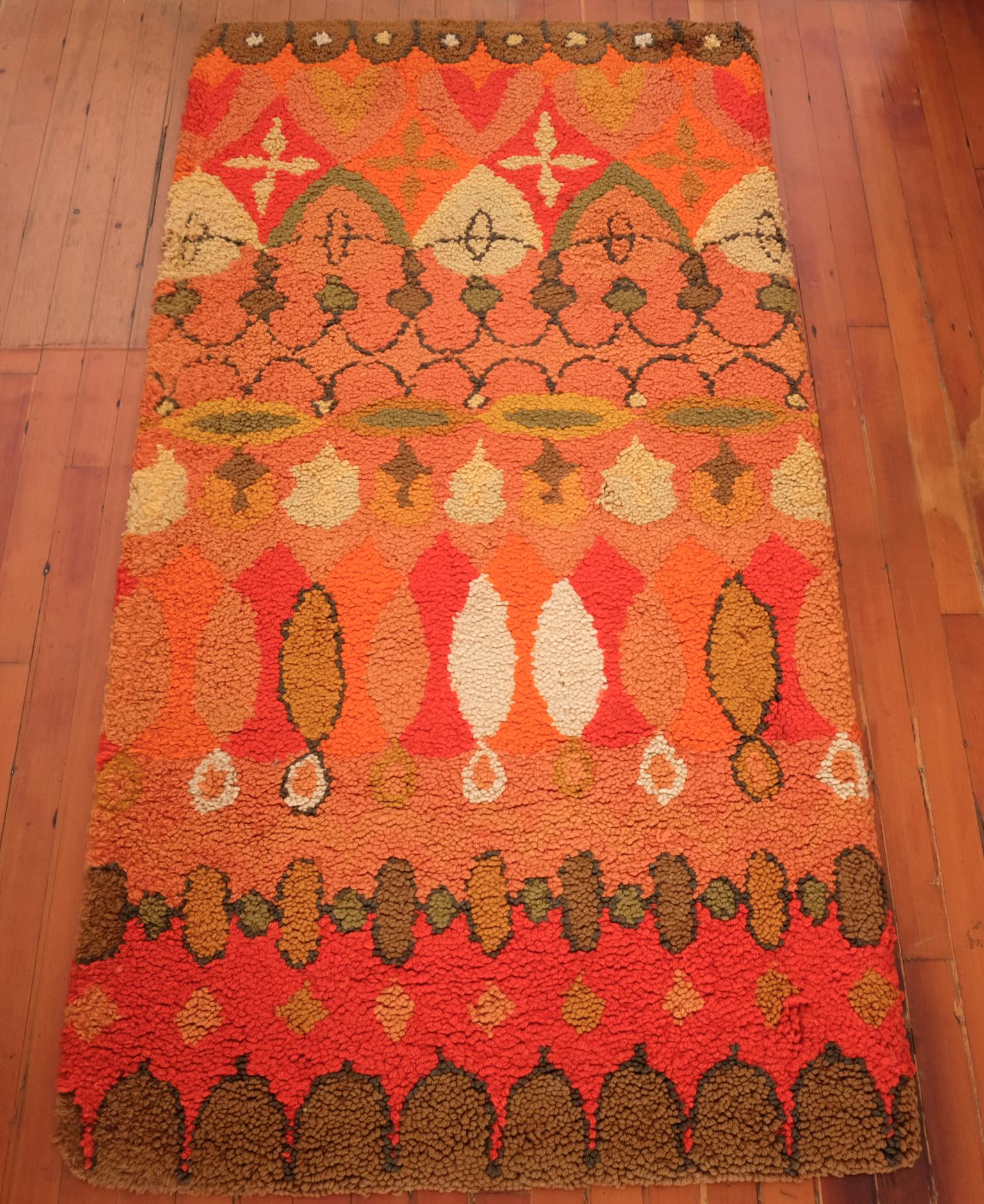 A hand-hooked rug by Cynthia Sargent (1922-2006). Handmade in Mexico City during the 1960s. Wool, with natural dyes. Retains the original label from the Riggs-Sargent studio. 

Cynthia Sargent went to Black Mountain College for music, but ended up