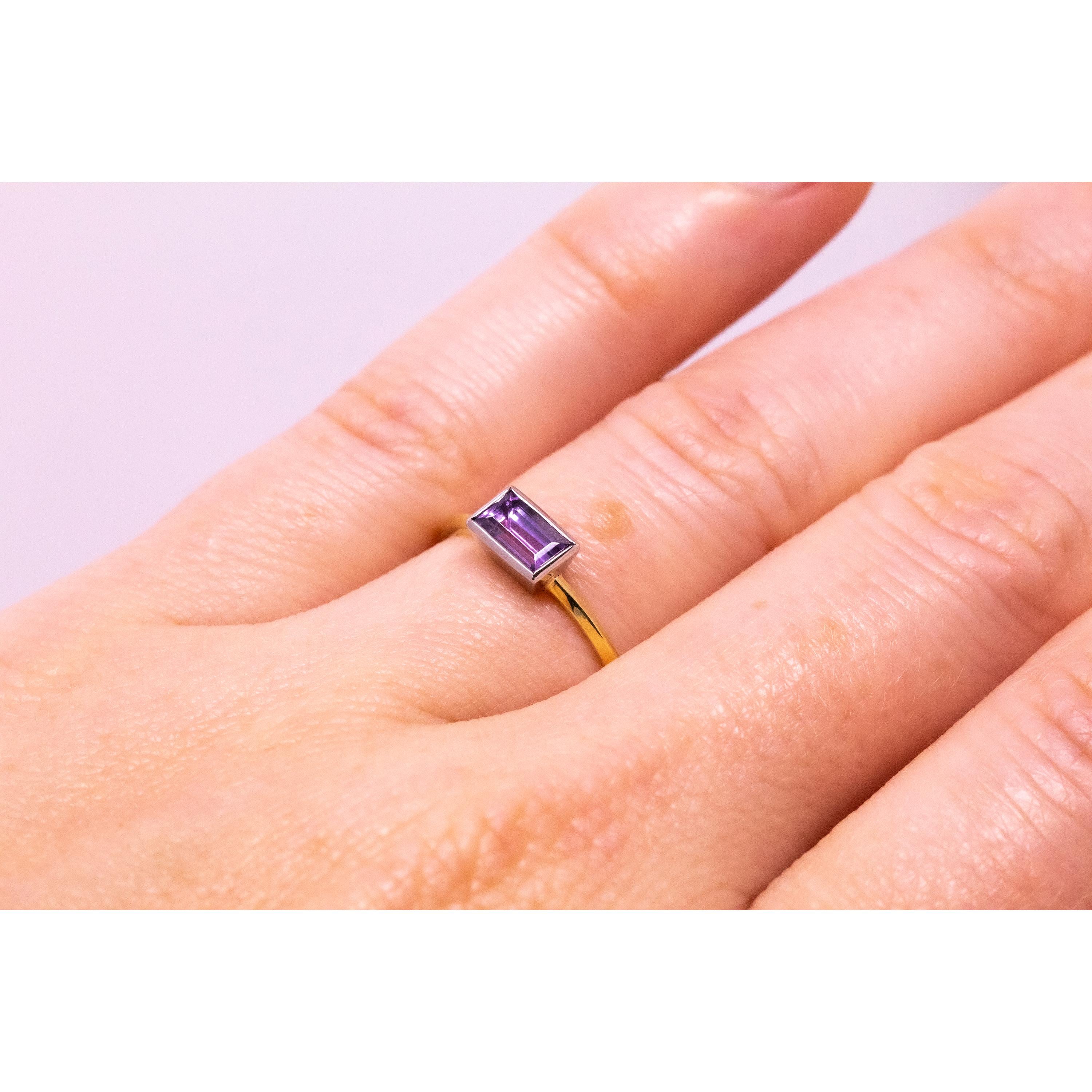 The striking and rare unheated, fancy color pink-lavender tanzanite sparkles perfectly in this fresh and modern ring. The eye-popping and unexpected hue is highlighted in a clean-lined emerald cut. This rare color of tanzanite is, by definition,