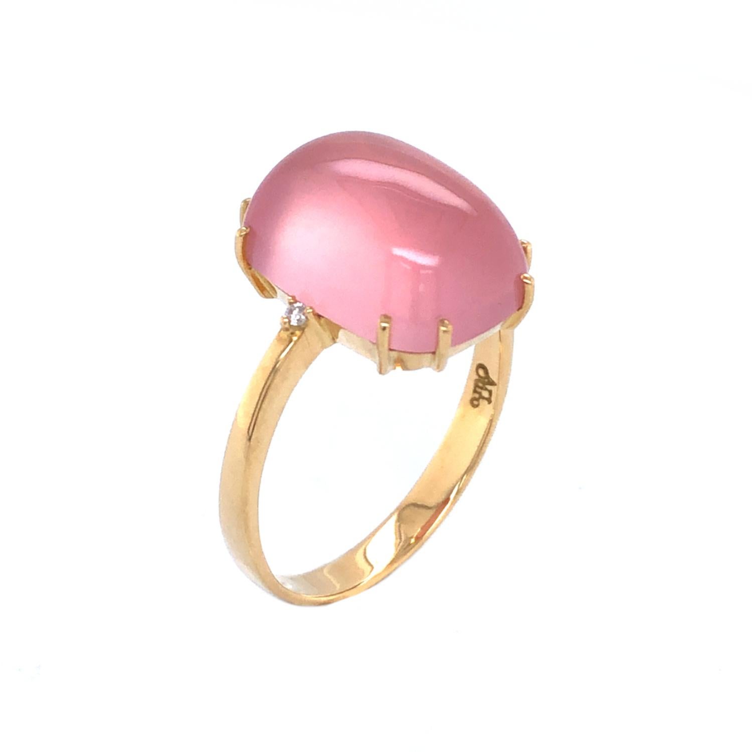 Simple yet elegant cabochon ring made with rose quartz and diamonds.

Materials:

- 18k solid gold ring

-A pair of 1.5mm G color, VS-2 clarity diamonds  

- 1 natural Brazilian rose quartz rectangle shape, cabochon style semi-precious