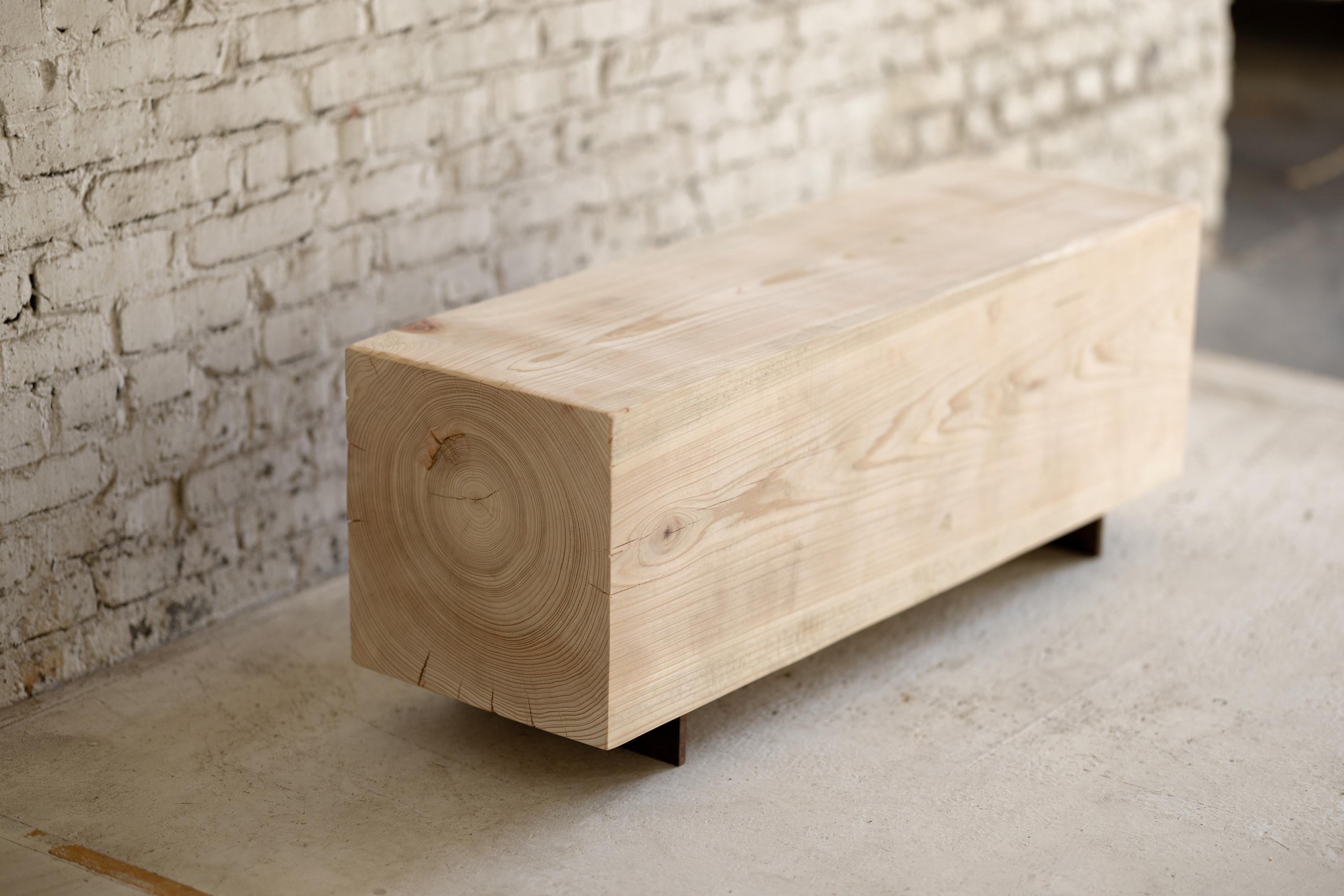 Our wood beam bench in cypress utilizes salvaged wood logs for a rustic seating experience. Narrow and backless, the simple lines express the natural texture of the end grain. The 15