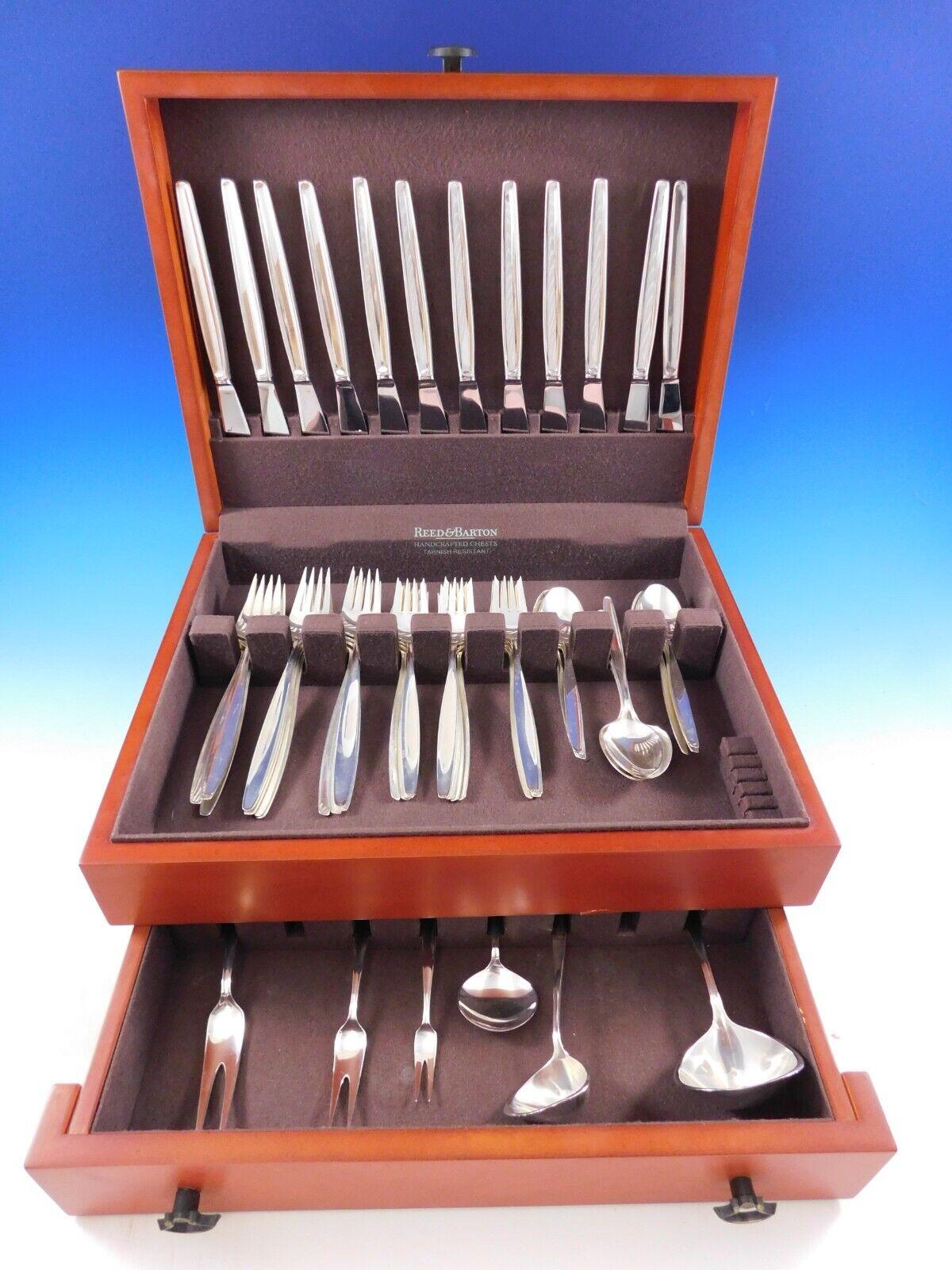Mid-Century Modern cypress by Georg Jensen sterling silver flatware set, 77 pieces. This set includes:

12 dinner size knives, long handle, 8 7/8