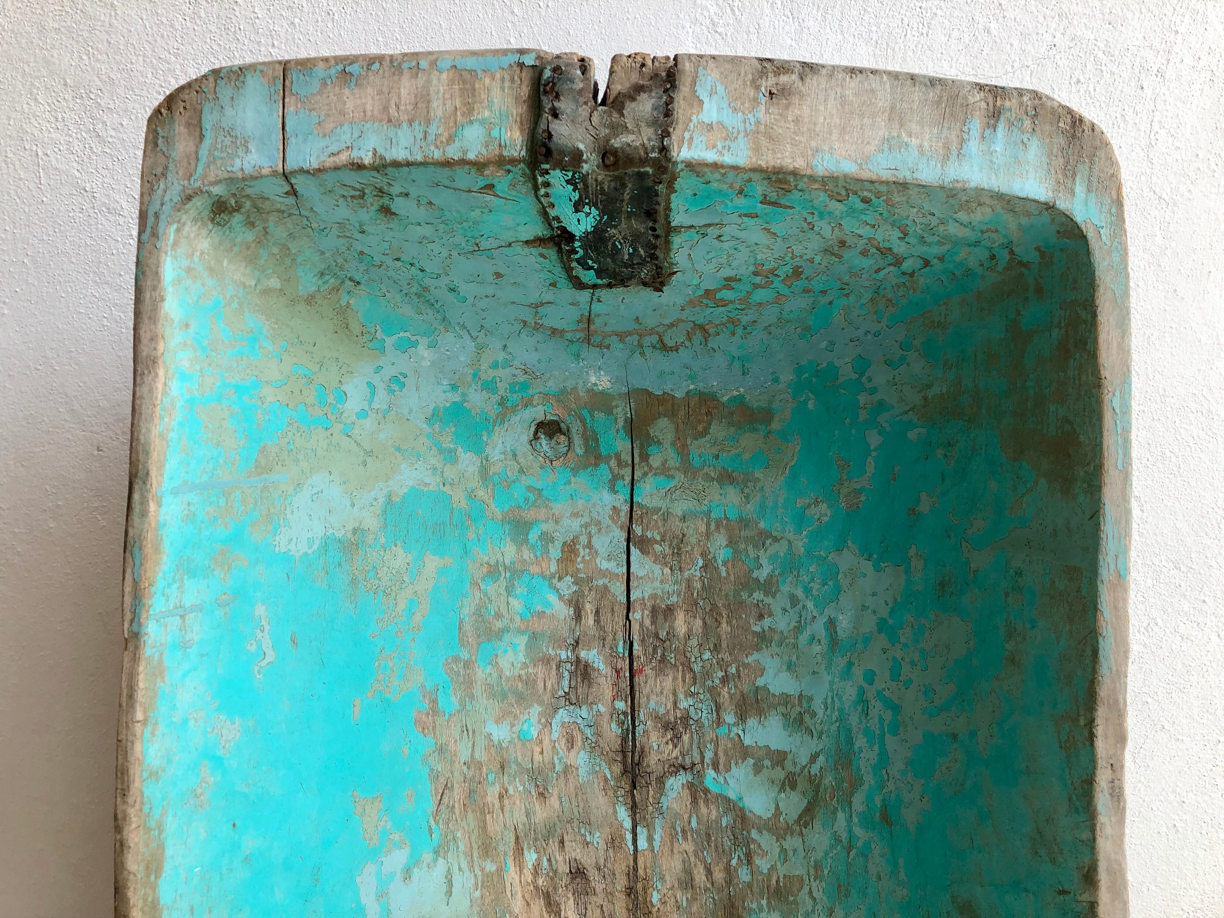 Turquoise painted, cypress wood wash basin trough from Central Mexico. Its washboard ridges are still apparent. Original leather patchwork to strengthen the piece. Original turquoise green paint.
