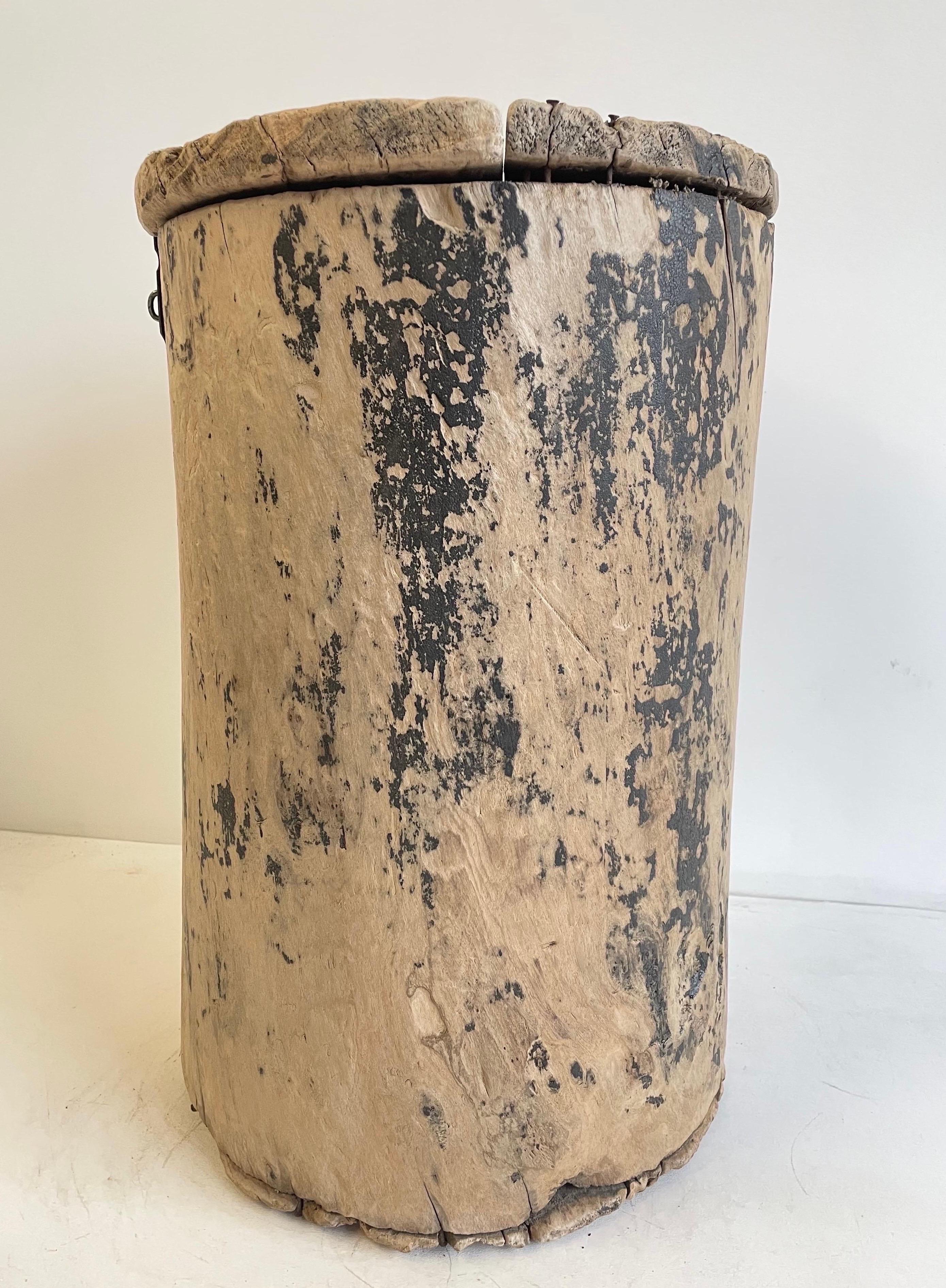 Very unique side table that is carved from a stump, with a lid and latch closure.
These make a great side table, or drink table, or use in an entry for your umbrellas. 
 Beautiful patina, can also be used to hold greenery. A great conversation