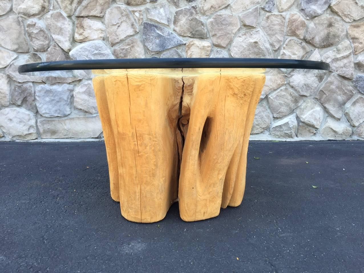 Organic cypress wood tree trunk coffee table.
Measures with glass: 35.5 in diameter x 17 height.
Trunk measures (without glass) 23 in diameter x 16 height.
   