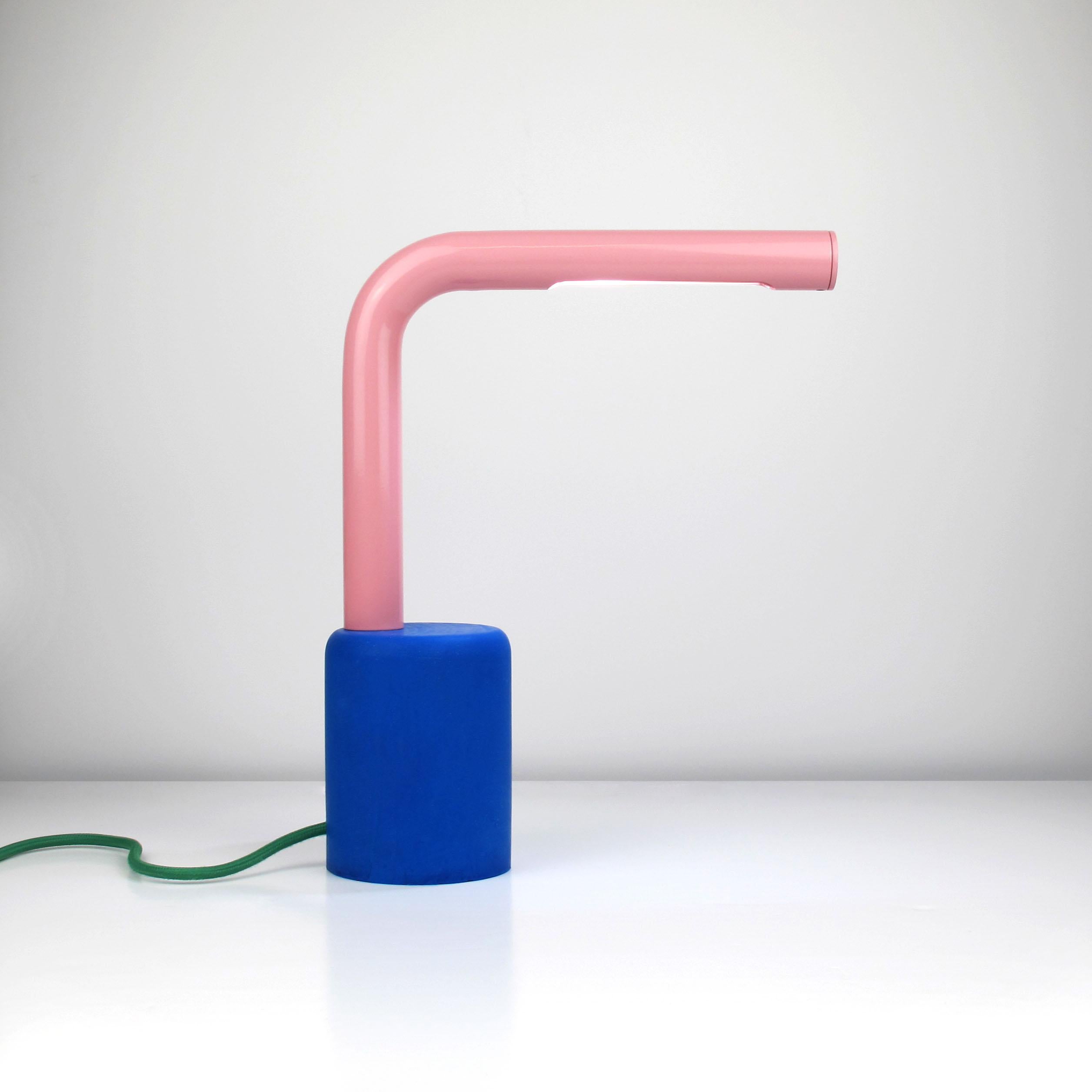 This beautiful and playful table lamp takes influence from postmodernism as well as many other objects around us.

All individually handmade to order, the tube can come in a range of RAL colors, cable colors and you can choose between a concrete