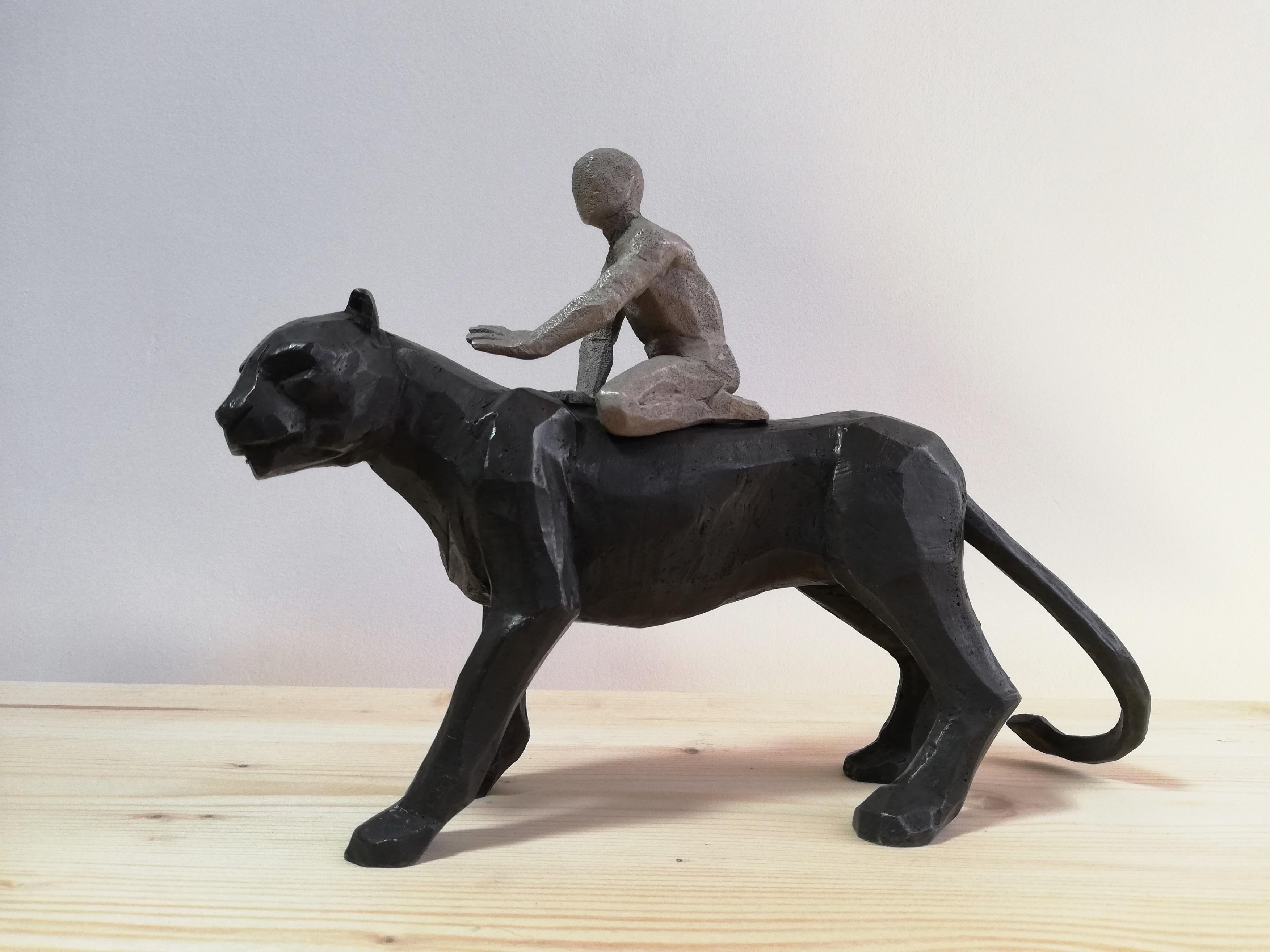 Passeur d'Ames bronze sculpture of a boy riding on a black panther's back  - Sculpture by Cyrille André