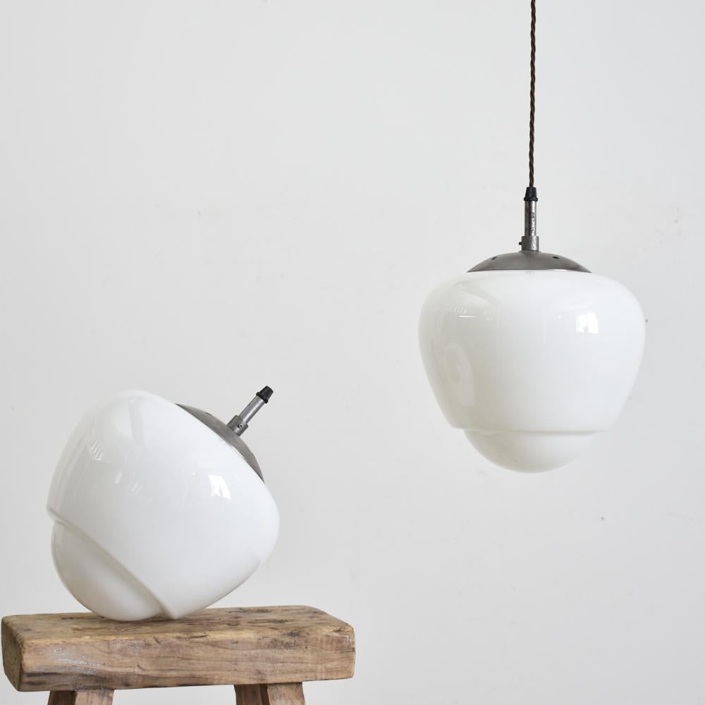 Czech opaline pendant light Acorn, B

A vintage opaline glass pendant light salvaged from an office in former Czechoslovakia, featuring a lovely moulded decorative acorn shape. The glass provides a striking even glow when illuminated. The light
