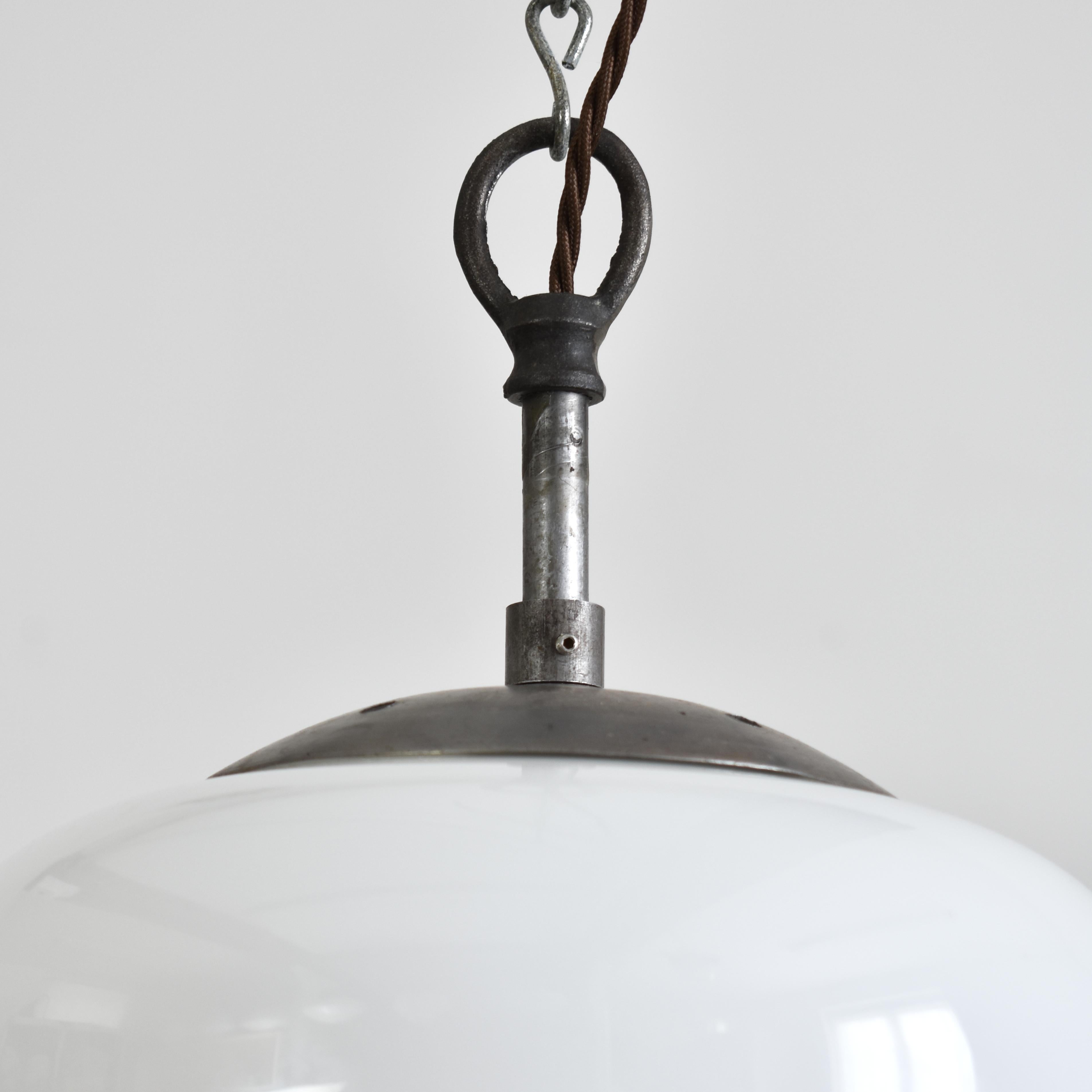 Antique Opaline Pendant Light Acorn – A

An antique opaline glass pendant light salvaged from an office in former Czechoslovakia, featuring a lovely moulded decorative shape. The glass provides a striking even glow when illuminated. The light