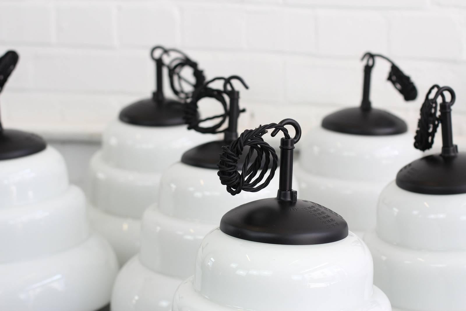 Czech Art Deco opaline pendant lights, circa 1940s

- Price is per light (Seven available)
- Beautiful stepped design
- Black bakelite tops
- Takes E27 fitting bulbs
- Comes with 100 cm of black braided cable
- Czech, circa 1940s
- Measures: