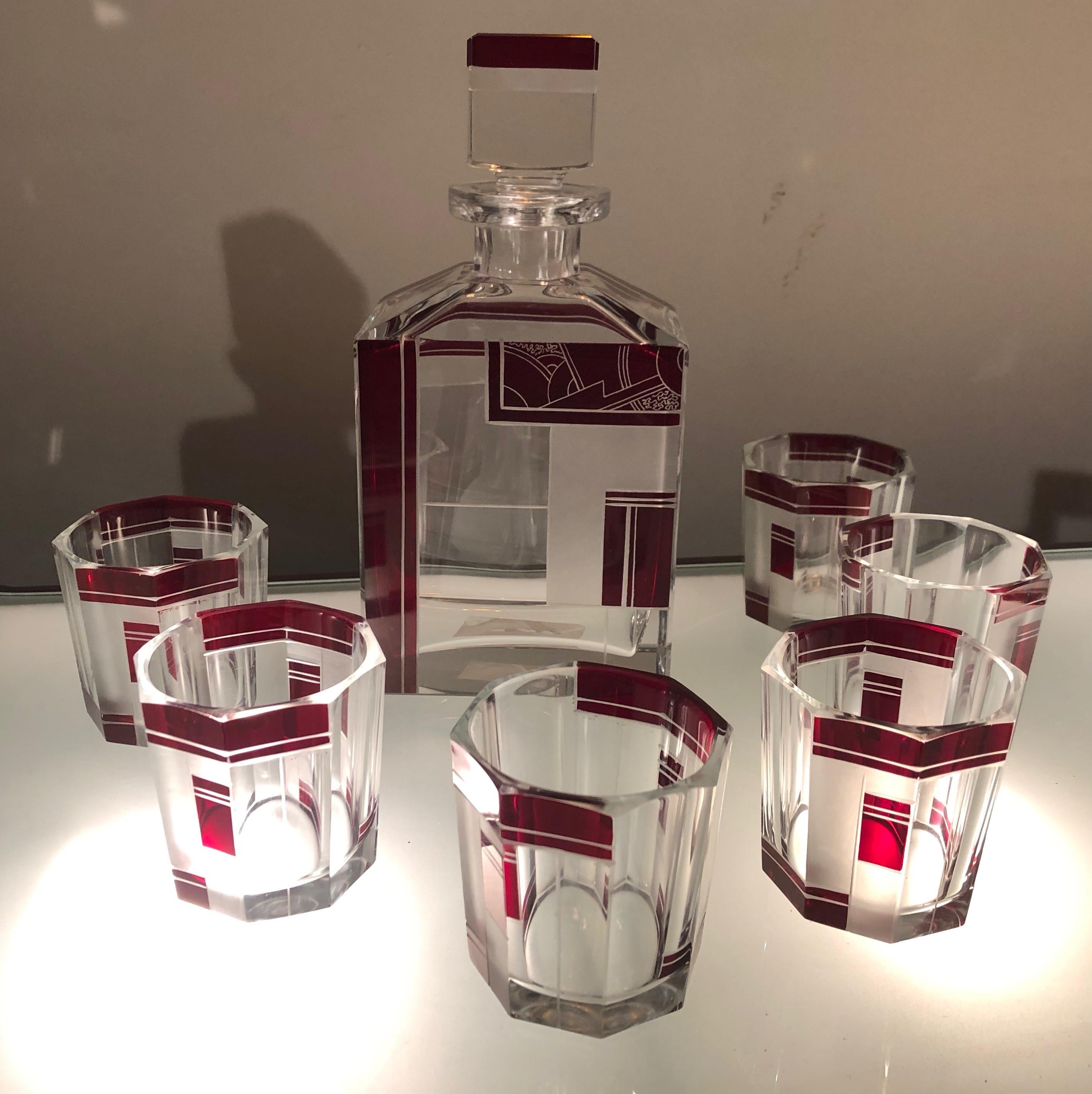 Art Deco Czechoslovakian decanter and six glasses from 1930, beautifully etched in heavy crystal. What makes this set quite special is the size and heft of the glasses, being enough for a serious drink, not just a sip of aperitif. It has a pleasing