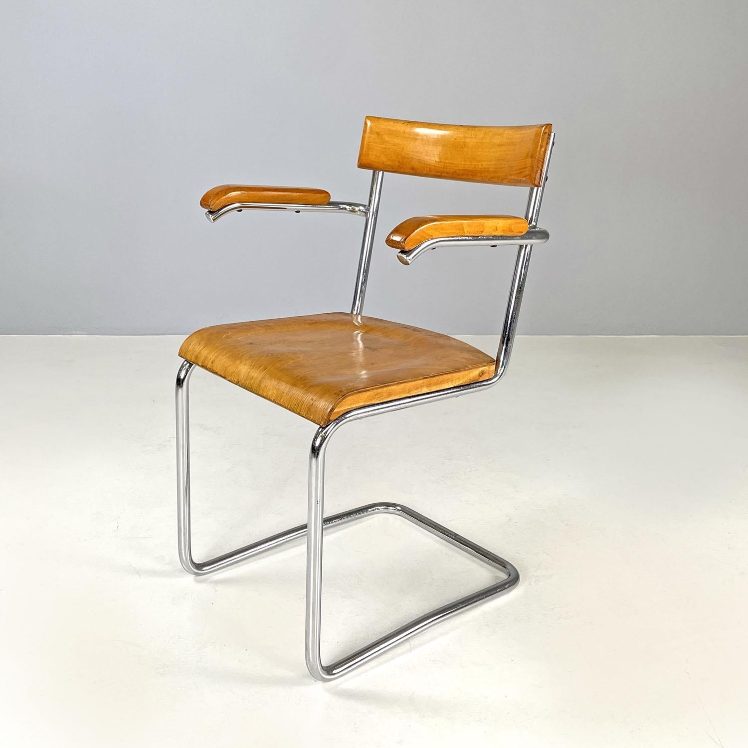 Czech Art Deco wood and chromed steel chair with armrests by Ladislav Zak, 1930s
Chair with armrests and rectangular seat. The structure is in chromed tubular steel, while the seat, backrest and armrests are in wood with curved lines.
Designed by