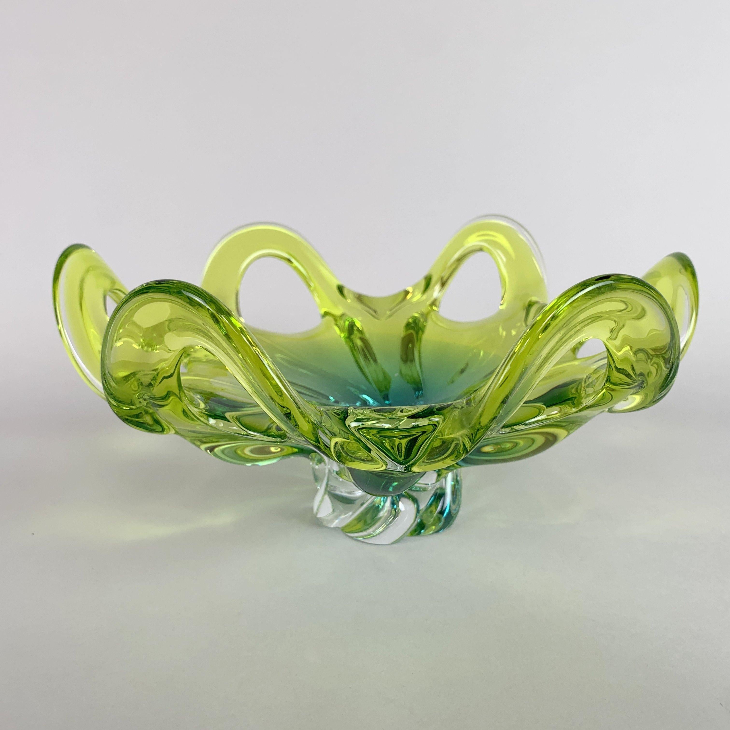 Heavy glass bowl designed by Josef Hospodka in the 1960s and manufactured by Chribska glassworks in Czechoslovakia.

The bowl is approximately 12.5 cm (4.92 inch) high and 26 cm (10.24 inch) wide across the widest point. It weights about 1.97 kg