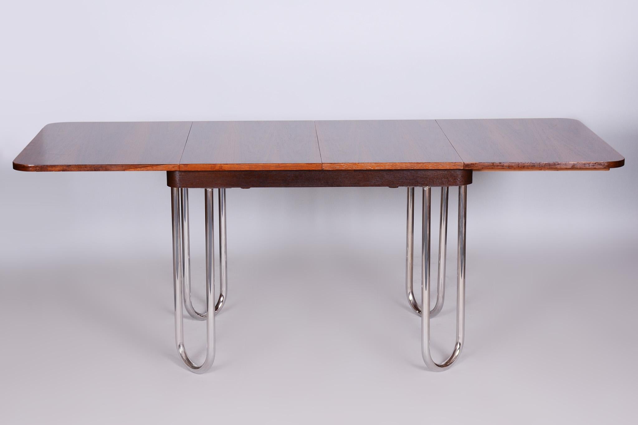 Czech Bauhaus folding dining table designed by R. Slezak.

Period: 1930-1939
Material: oak, walnut, chrome-plated steel
Restored.

Adjustable width in 3 dimensions:
111, 158 and 205 cm (43.7 in, 62.2 in and 80.7 in)

