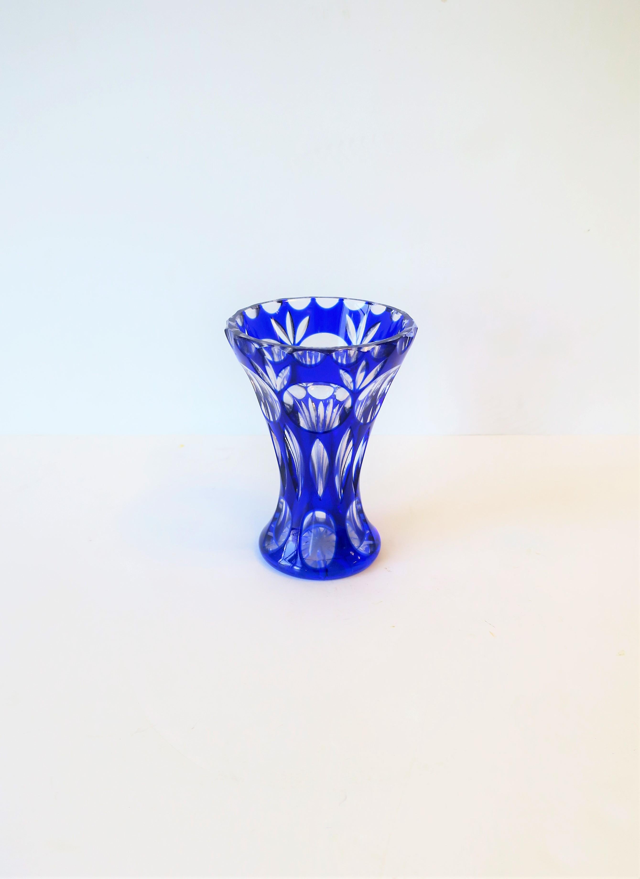 A very beautiful small and substantial Bohemian clear and sapphire blue crystal vase, circa early 20th century, Czechoslovakia. Vase is in the style of luxury crystal glass maker Moser. Piece is substantial with beautiful cut details from top to