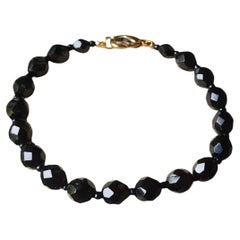 Czech Bohemian 20th Century Black Faceted Glass Bead Gold Tone Clasp Bracelet