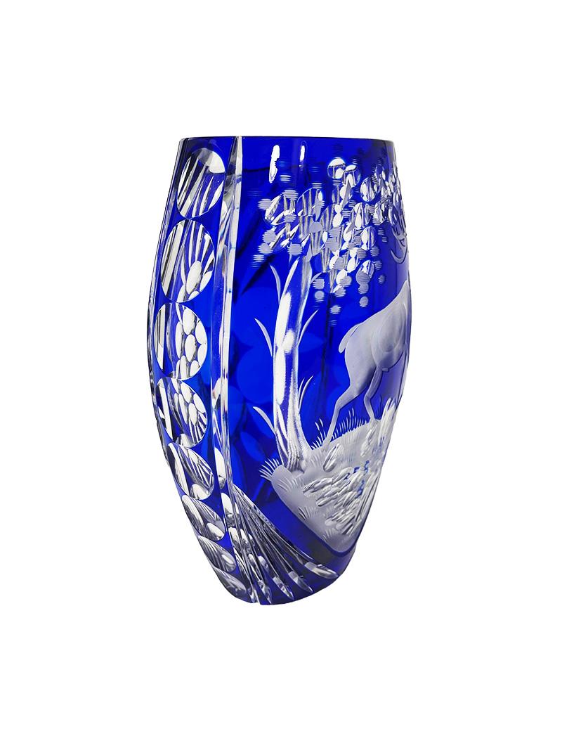 Czech Bohemian blue cut to clear crystal vase, 1980s

A beautiful Bohemian thick-walled blue cut to clear crystal vase with a scene of a matte engraved deer in a landscape, surrounded with clear cut crystal shapes of rounds, stripes and a shape of a