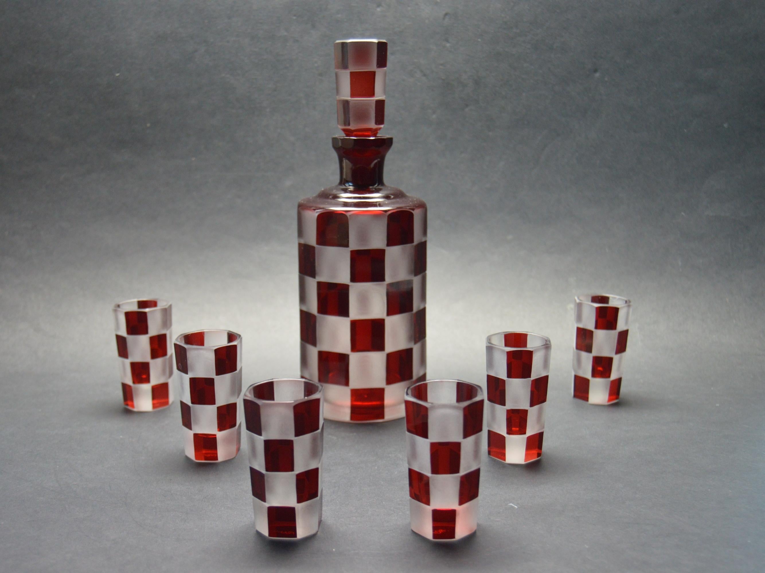 Czech Decanter set by Eduard Poesch, exceptional Bohemian quality and very unique design. Signed by the artist and made in 1944. Bold, geometric designs in an octagon-shaped glass with faceted decanter all part of the Czechoslovakian Bohemian glass