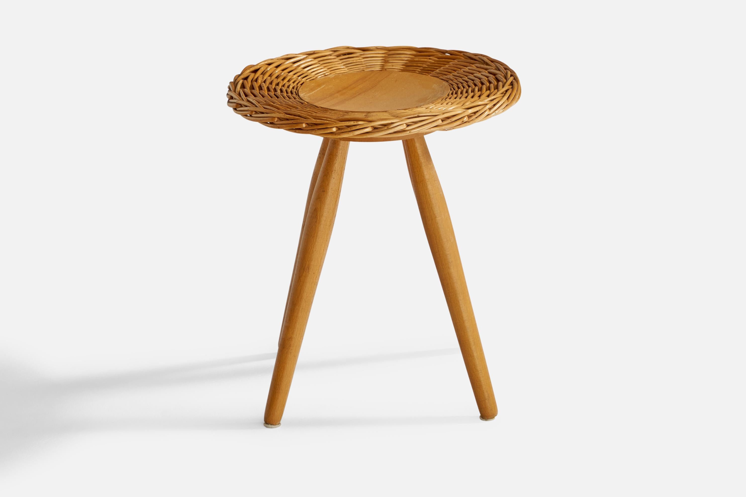 An oak and rattan stool designed and produced in the Czech Republic, 1950s.

Seat height: 15.95”