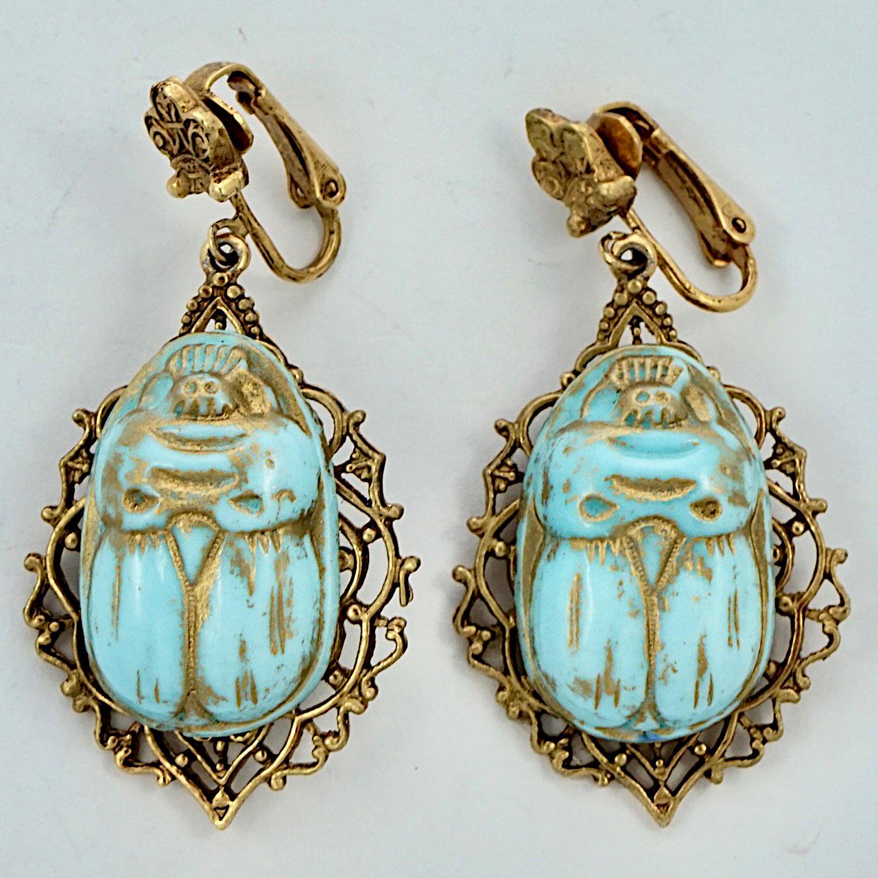 Fabulous Czech Egyptian Revival ornate gold plated clip on drop earrings, with lovely pale blue and gold painted glass scarabs. Measuring length 5.1 cm / 2 inches including the clips, by width 2.6 cm / 1 inch.

This is a beautiful pair of Egyptian