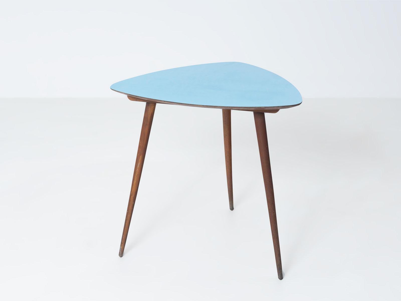 Coffee table with blue formica top, Czechoslovakia, 1960s.
The top features a geometrical pattern of thin grey stripes on light blue background.
Oak legs. Good original condition.