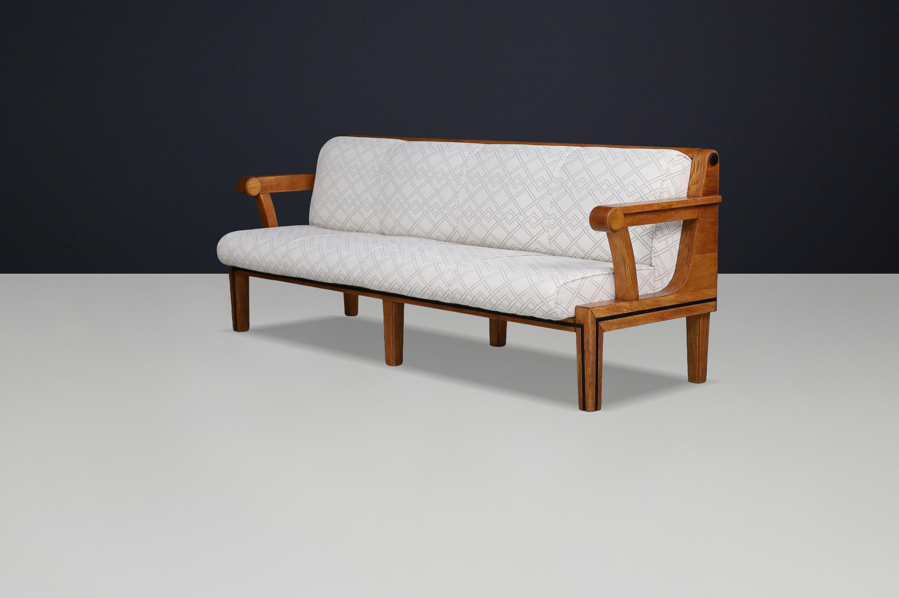 Czech Functionalist Oak Three-Seat Sofa, Czechoslovakia, 1930s

This exceptional three-seat sofa from Czechoslovakia, dating to the 1930s, is a refined example of Czech Functionalist design — a movement that elegantly balanced architectural form