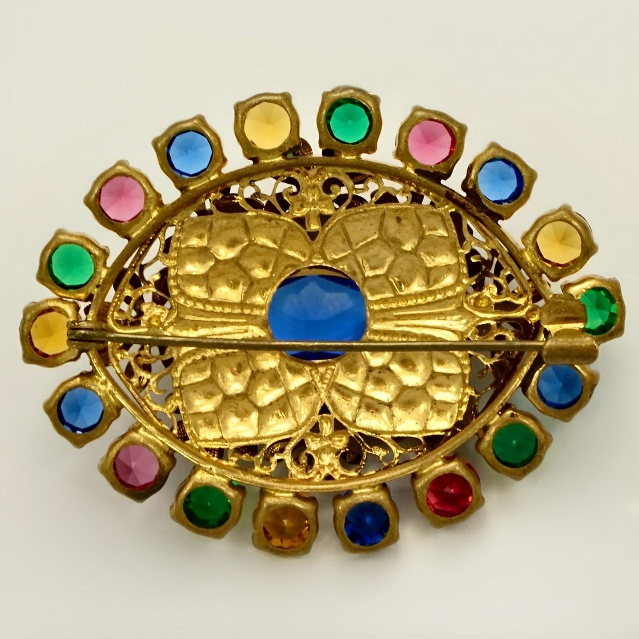 Beautiful Czech gilt metal floral brooch, with lovely multi coloured glass stones. Measuring length 5.5 cm / 2.1 inches by 4.4 cm / 1.7 inches. The brooch is in very good condition. There is wear to the gilt metal.

This is a wonderfully stylish