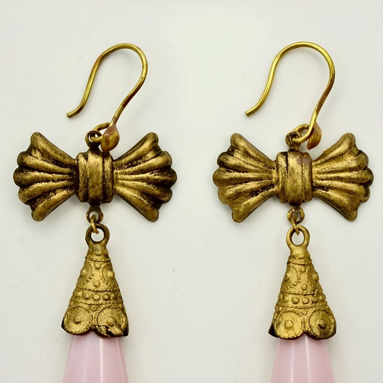 Fabulous Czech ornate gilt metal drop earrings. Featuring lovely pink and gold long glass drops with a floral design, and a bow top. Measuring length 7.6 cm / 3 inches not including the hooks. The earrings are in very good condition. There is some