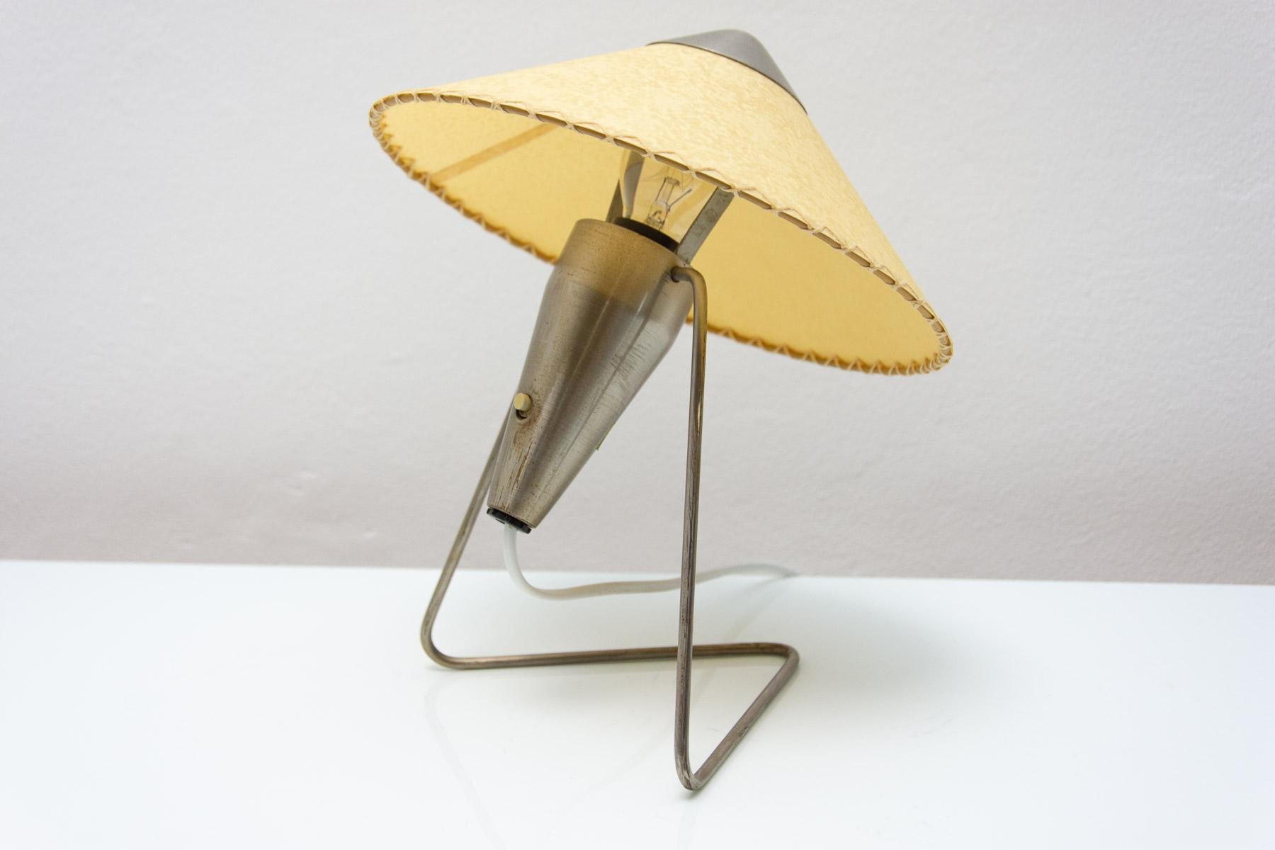 Mid century modern desk lamp was designed by Helena Frantova and produced by Okolo in the 1950 in the former Czechoslovakia.  It has chrome structure.

This lamp was made by Žukov company.

This table lamp exists in several variations. Made with a