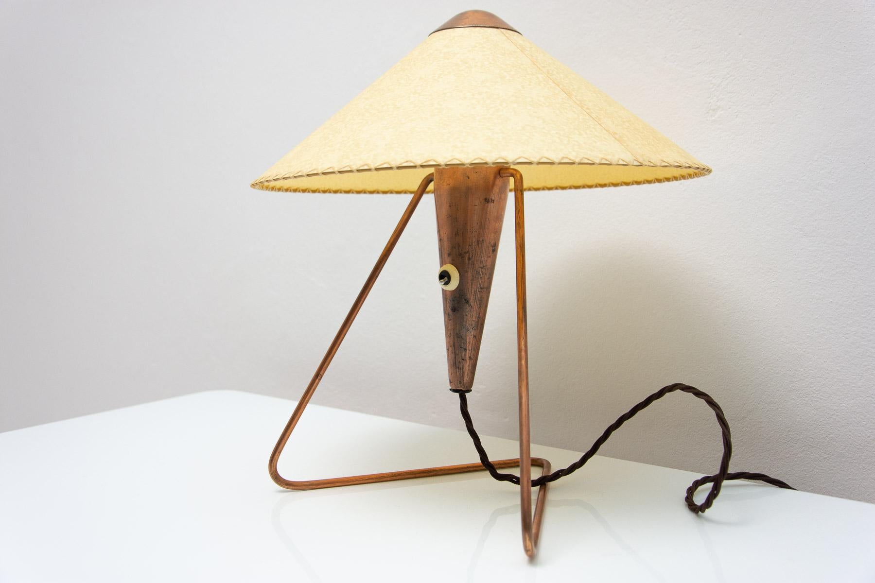 Mid century modern desk lamp was designed by Helena Frantova and produced by Okolo in the 1950 in the former Czechoslovakia. It´s made of brass.

This lamp was made by Žukov company.

This table lamp exists in several variations. Made with a