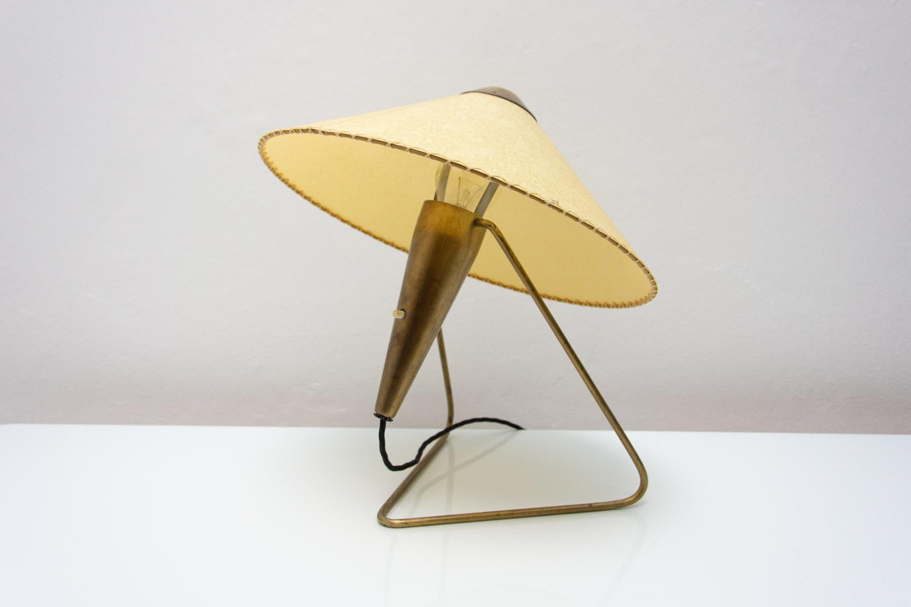 Mid century modern tripod desk lamp was designed by Helena Frantova and produced by Okolo in the 1950 in the former Czechoslovakia. It´s made of brass.

This lamp was made by Žukov company.

This table lamp exists in several variations. Made with a