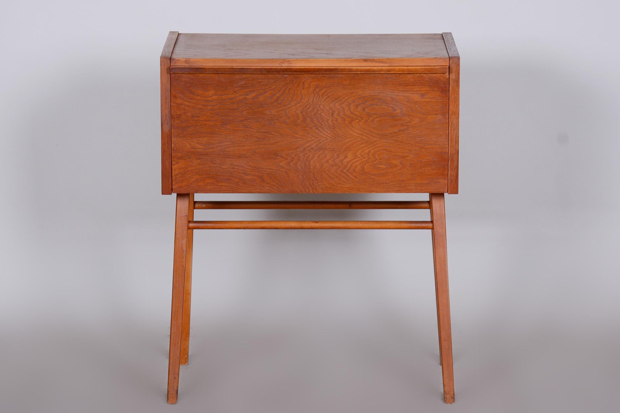 Completely restored Czech mid-century side table - cabinet made out of oak, 1950s, refreshed polish.

Stable construction
Refreshed polish
Fully functional

Period: 1950-1959.