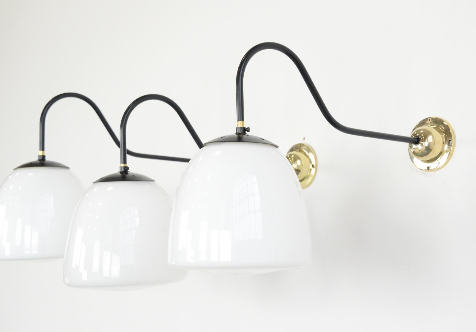 Czech Opaline wall lights, circa 1940s

- Price is per light (5 available)
- Curved arm with cast brass wall plate
- Wires directly into the wall
- Takes E27 fitting bulbs
- Czech, 1940s
- Measures: 62cm deep x 25cm wide x 42cm