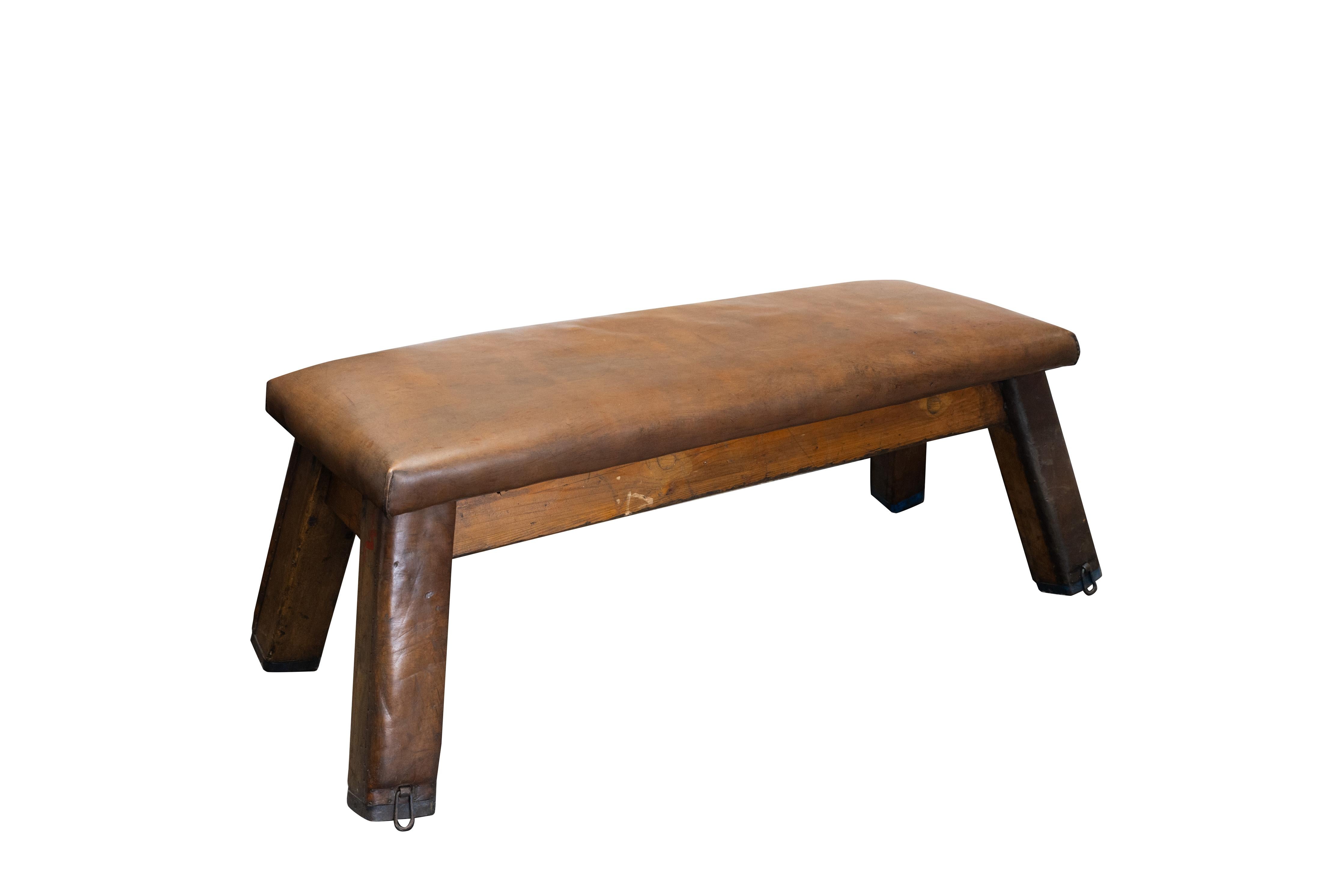 Czech Republic Vaulting Horse Bench with Padded Legs. Made from iron, wood, and leather. We cut down the legs to make them table height. Fun. Circa 1940.

Dimensions: 19 3/4