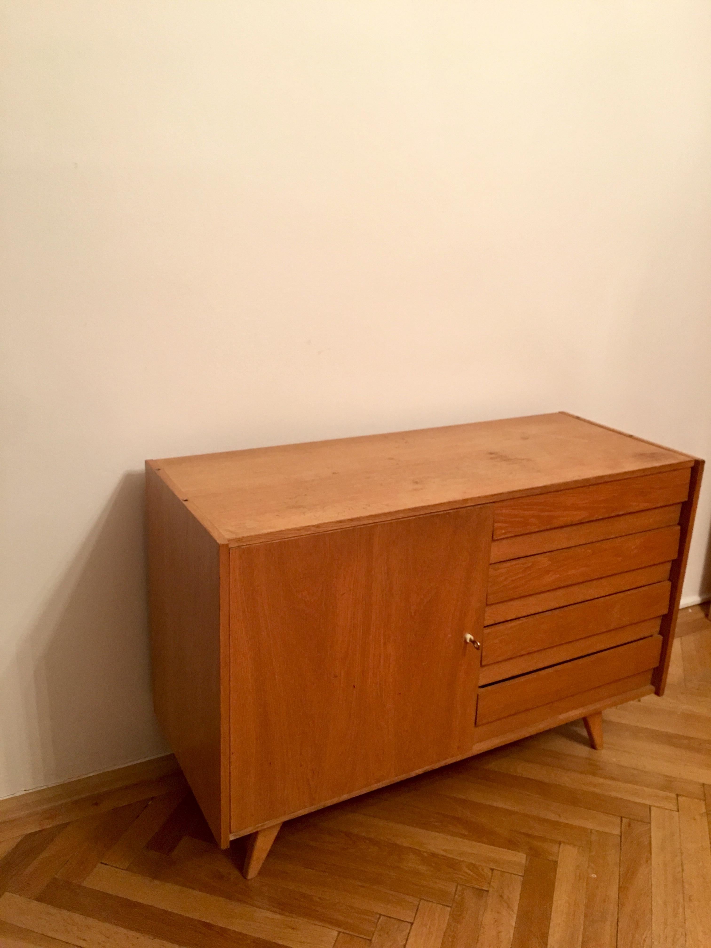 Original vintage sideboard with one door and the side drawers. Type U-460, manufactured in the 1960s by Interier Praha, designed by Jiri Jiroutek. Wooden construction and wooden drawers.
Manufacturer: Interier Praha
Country: