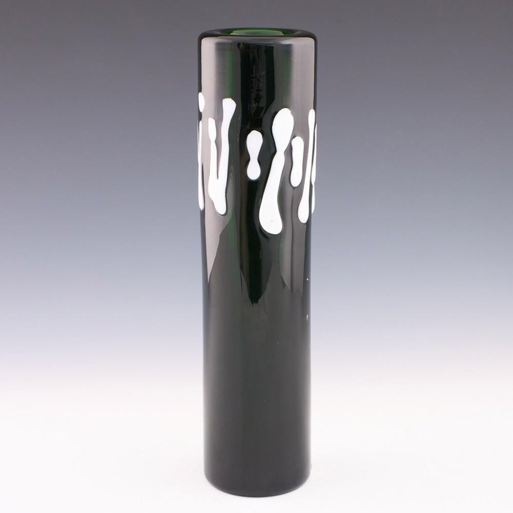 Heading : Czech skrdlovice green cylinder vase
Date : Designed 1975
Origin : Skrdlovice, Czechoslovakia (now Czech Republic)
Bowl Features : Cylinder form with deep green glass with white decoration
Marks : Original paper label
Type : Lead
Size :